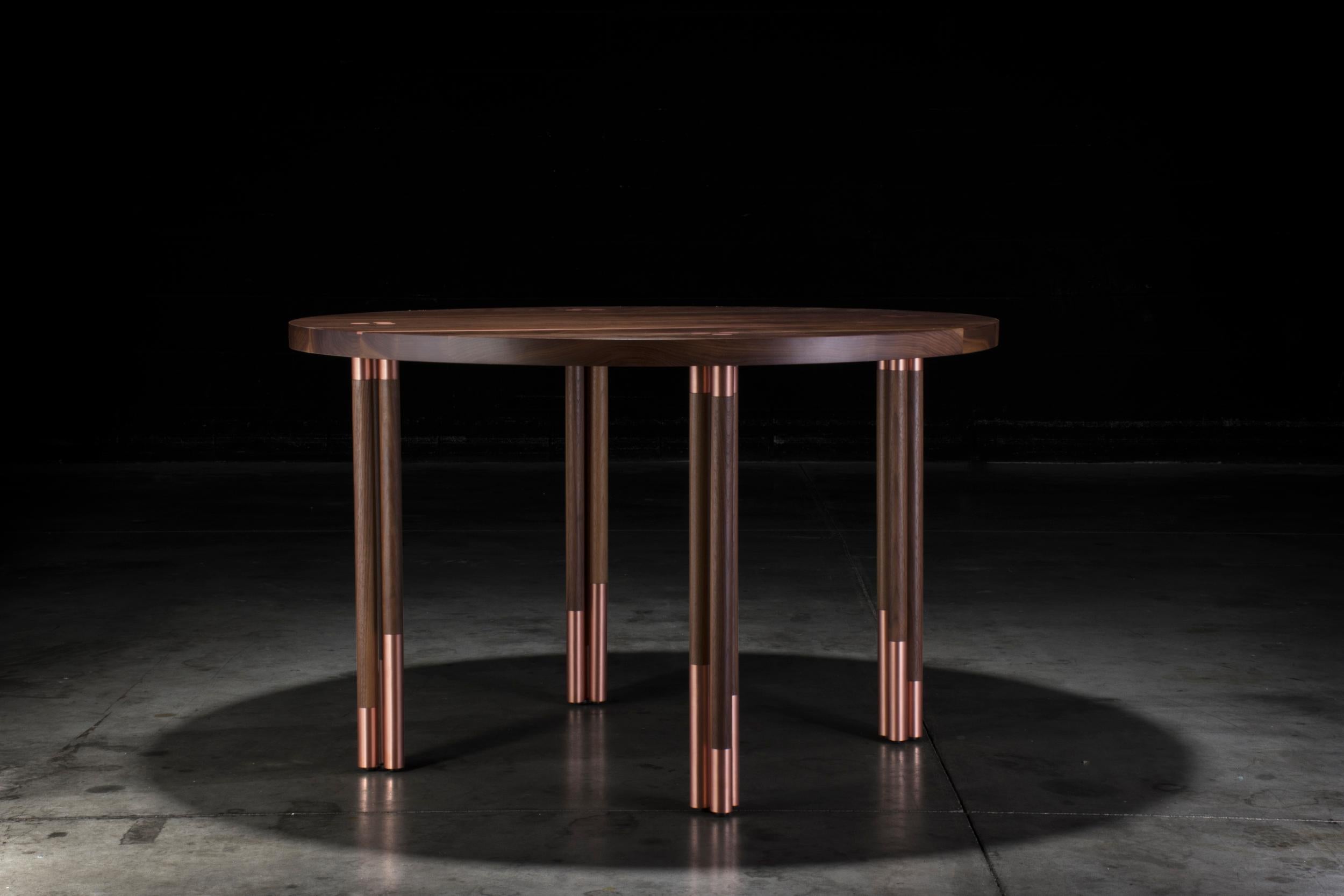 With the use of copper inlays and solid walnut, the Canfield dining table was created with an elegant and modern look. With handcrafted copper and walnut legs, this piece can stand out and be a featured piece of many different rooms.


This is a