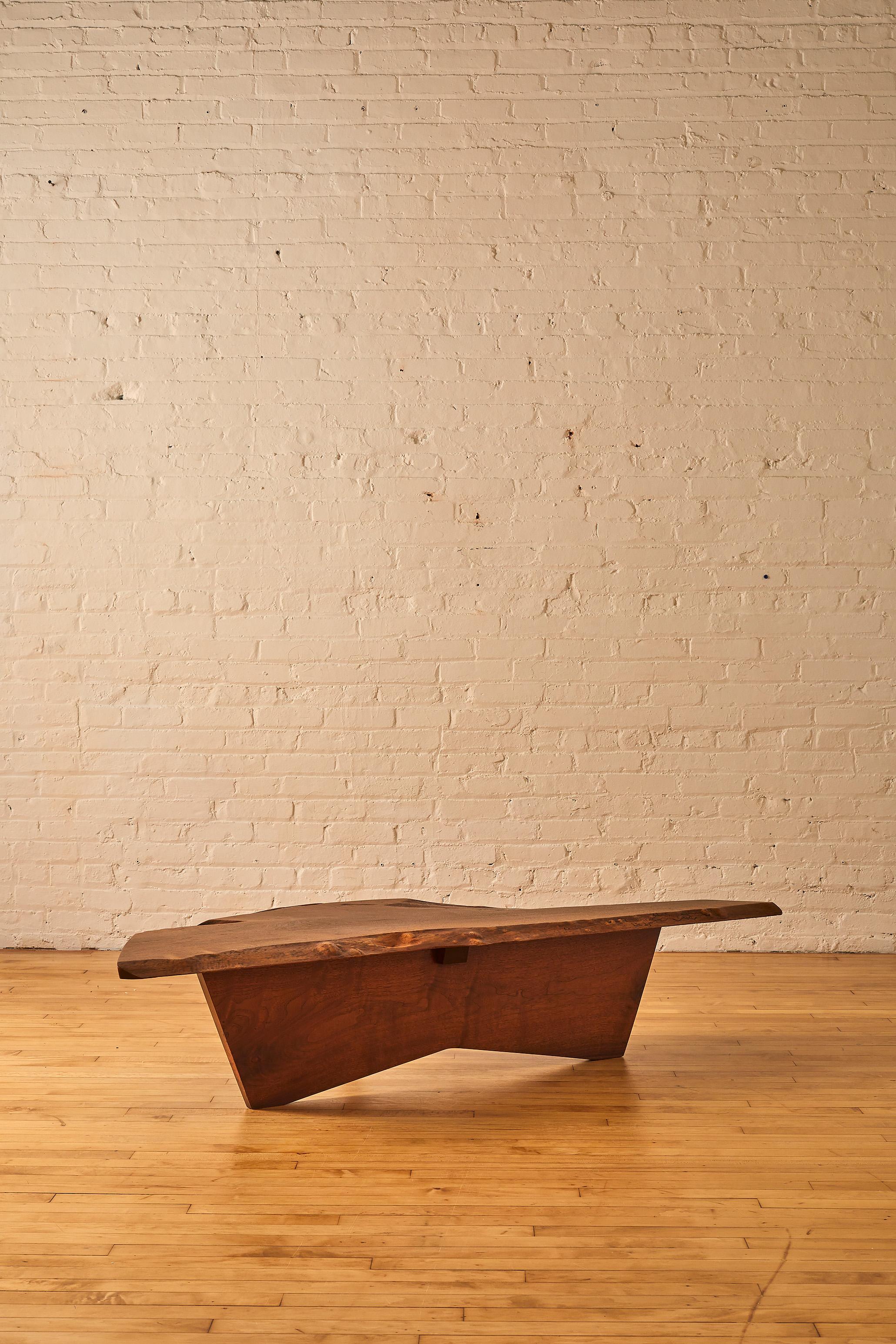 An Original Walnut Coffee Table by George Nakashima. 

About George Nakashima:

George Katsutoshi Nakashima was an American woodworker, architect, and furniture maker who was one of the leading innovators of 20th century furniture design and a