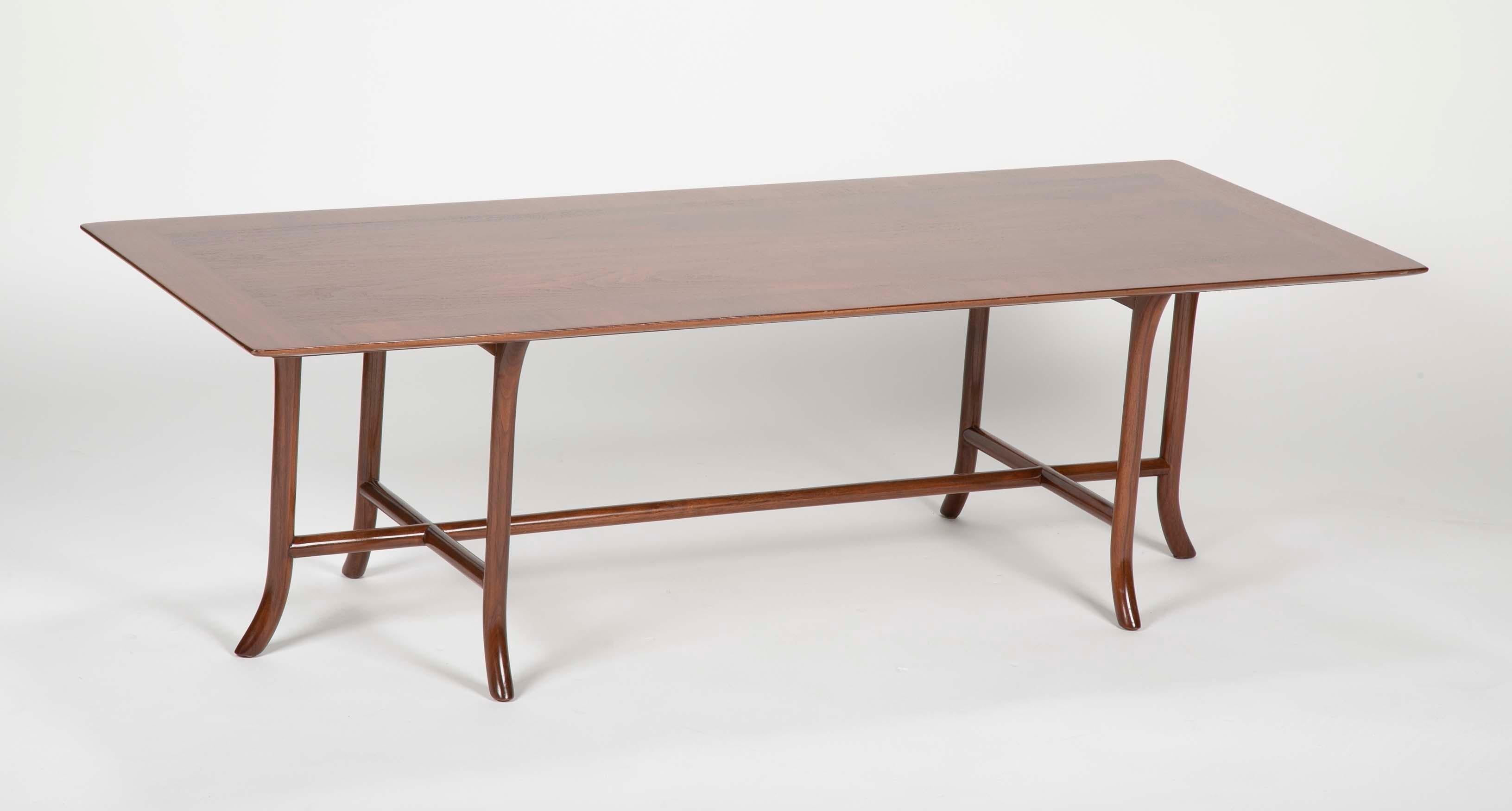 A walnut 6 saber legged coffee table by T.H. Robsjohn-Gibbings for Widdicomb.