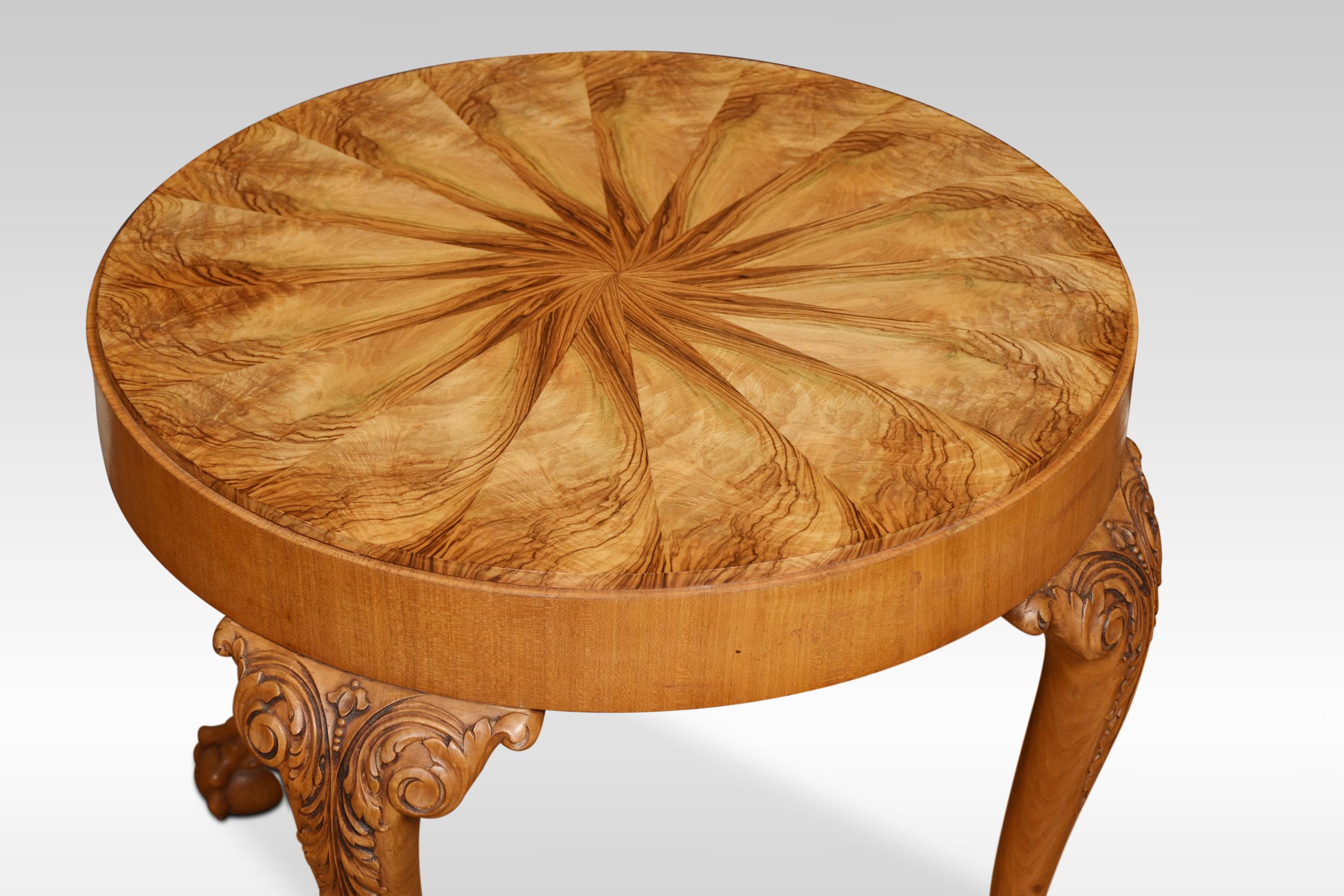 Walnut coffee table the circular well figured top raised up on four carved cabriole legs terminating in claw and ball feet.
Dimensions
Height 21.5 inches
Width 27 inches
Depth 27 inches.