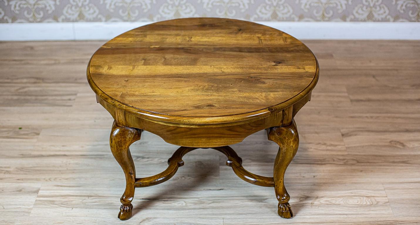 Walnut Living Room Coffee Table from the Early 20th Century in Light Brown

We present you a low coffee table made of solid walnut.
It was manufactured in Q1 of the 20th century.
The whole table is placed on four bent legs connected with stretchers,