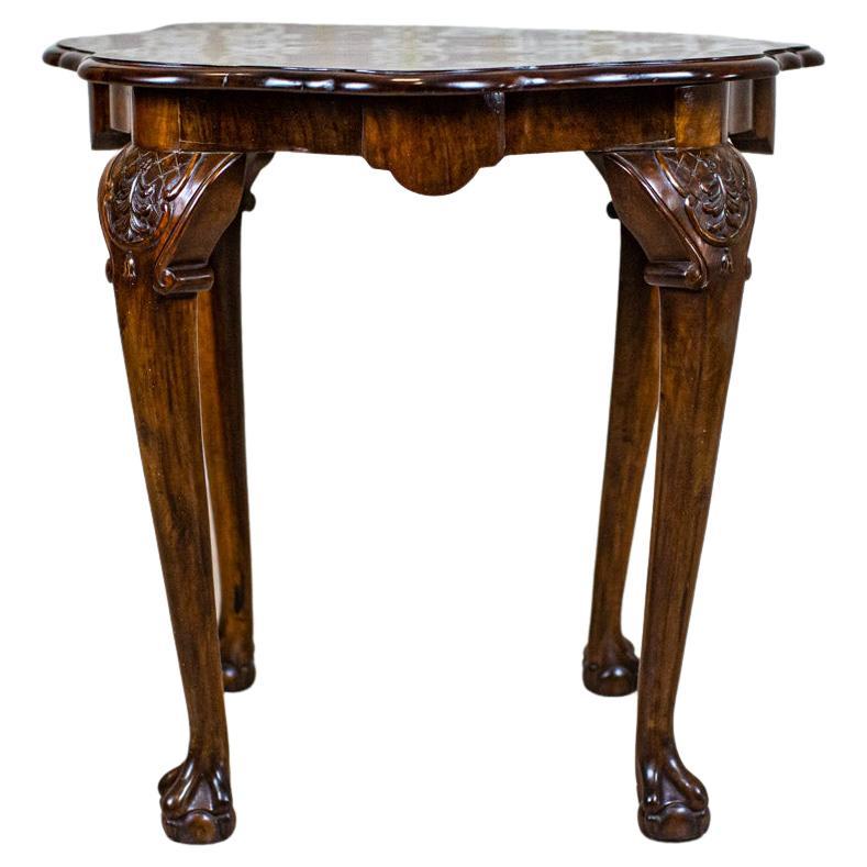 Restored Walnut Coffee Table from the Early 20th Century

We present you a walnut coffee table from the early 20th century.
The top is covered with walnut veneer.

This piece of furniture has undergone renovation and is finished in French polish.