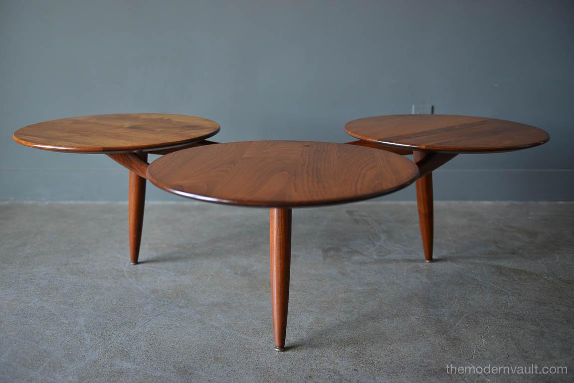 Walnut coffee table in the style of Greta Grossman, circa 1959. Three circular tops on a floating sculpted walnut base. Manufactured by Ace Hi of Los Angeles, CA. Very good to excellent original condition with only very slight use. Each circular top