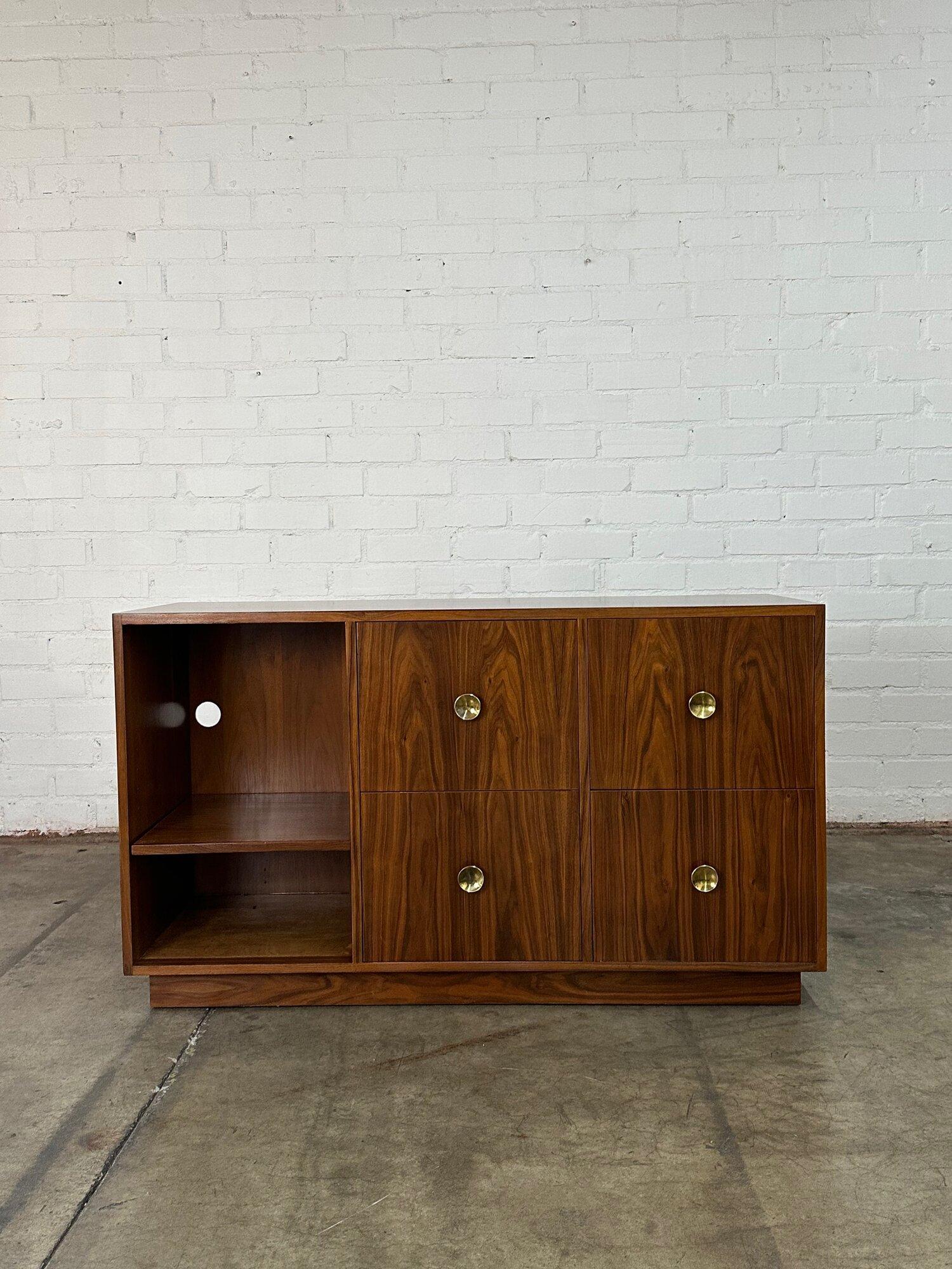 W52 D18 H30

Walnut dual use sideboard with open shelving and enclosed storage. Item has been fully restored and is structurally sound and sturdy. Item sits on a plinth base for great stability.