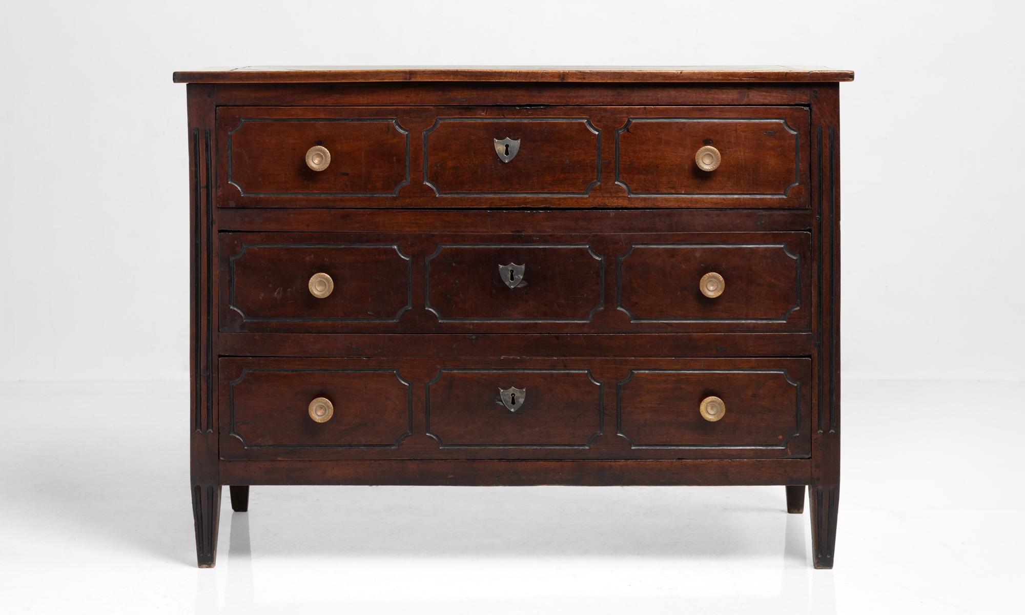 Walnut commode, France, 18th century.

Beautifully patinated form with circular pulls and (3) drawers.