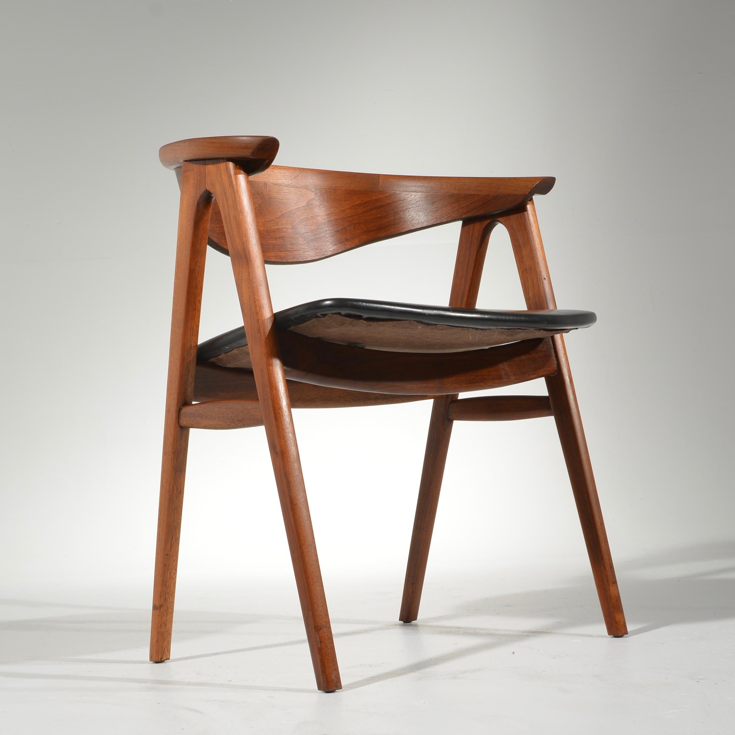 Erik Kirkegaard designed this model 52 armchair for Høng Stolefabrik in 1952. 
All chairs have been fully restored including walnut finish and joinery. Shown with original upholstery, please inquire for re-upholstery options.