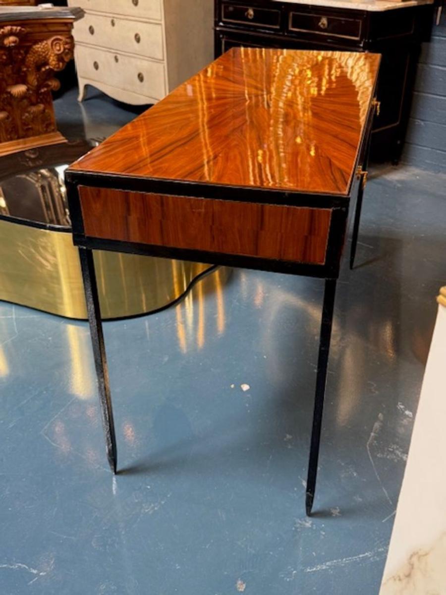 Handsome MCM design walnut and black steel console after Jean-Michel Frank. A walnut and black steel console in his style is a masterstroke of quiet luxury. These pieces are perfect for anchoring an entryway, flanking a gallery wall, or adding