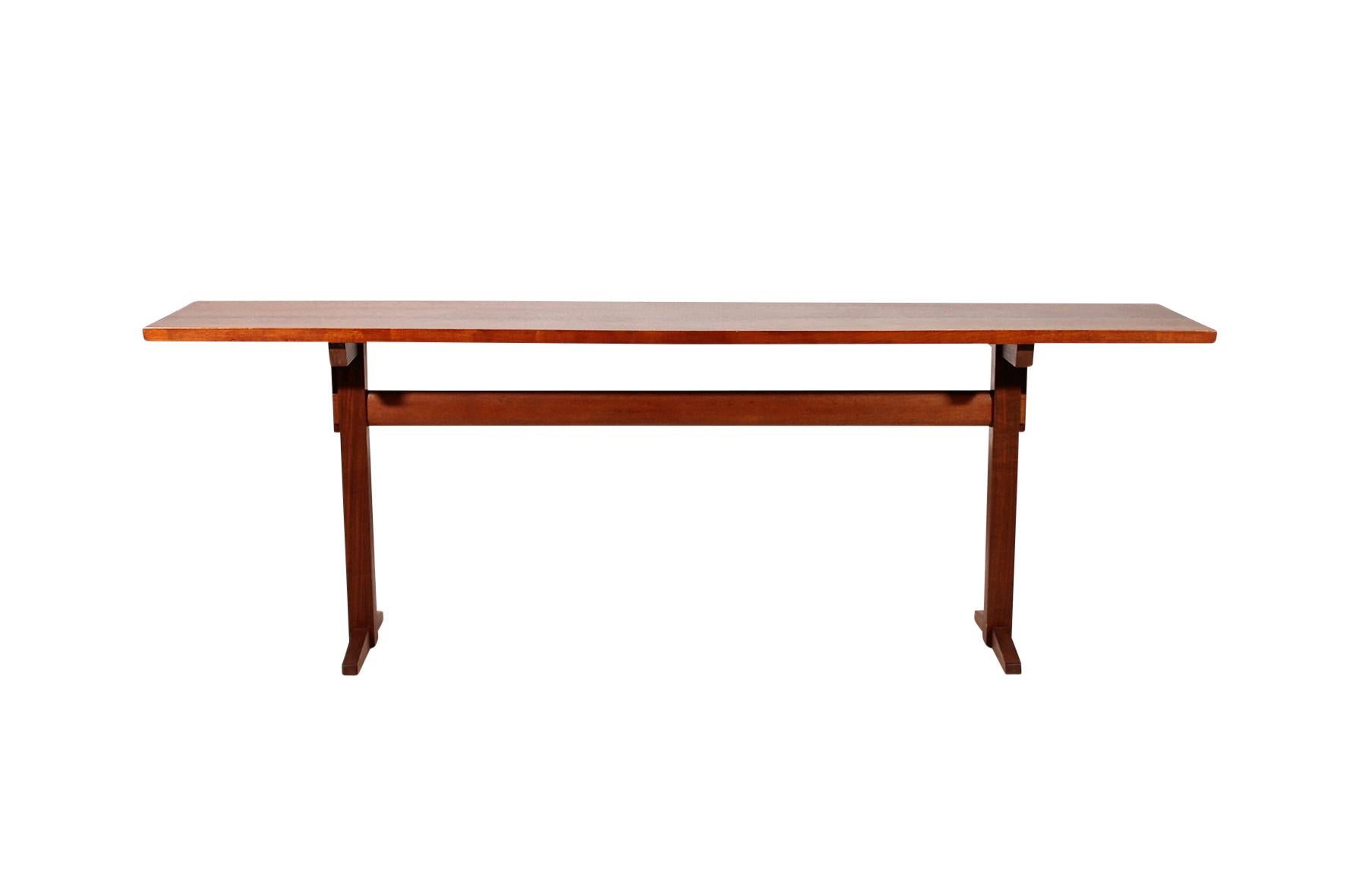 Rare and elegant 7 ft. walnut trestle console table by famed Japanese American woodworker and designer George Nakashima, circa 1959. Provenance included. Very good condition.
