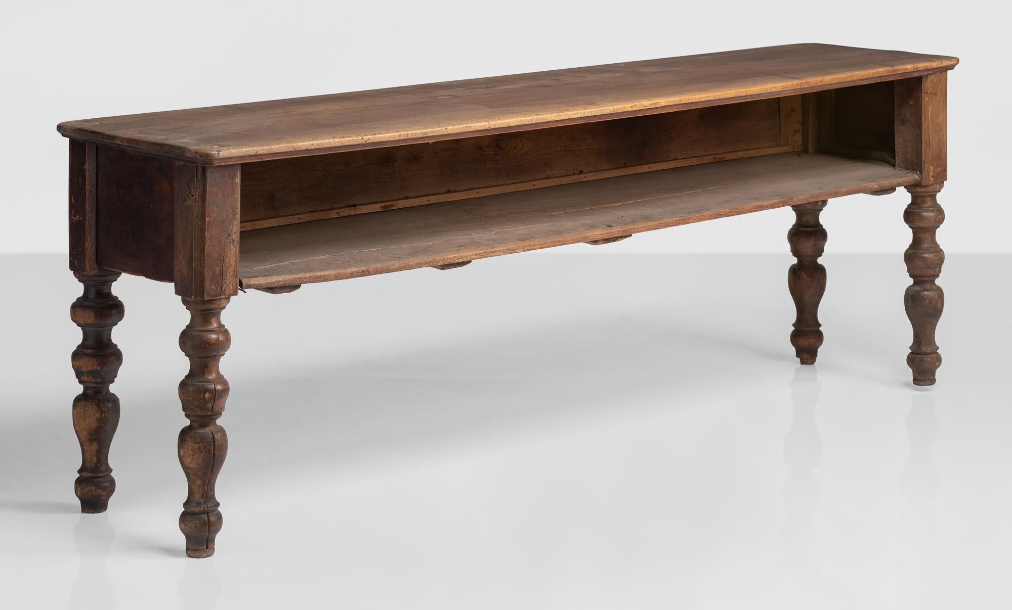 Walnut convent console, Italy, circa 1790

Simple form with open front and generous storage on turned legs.