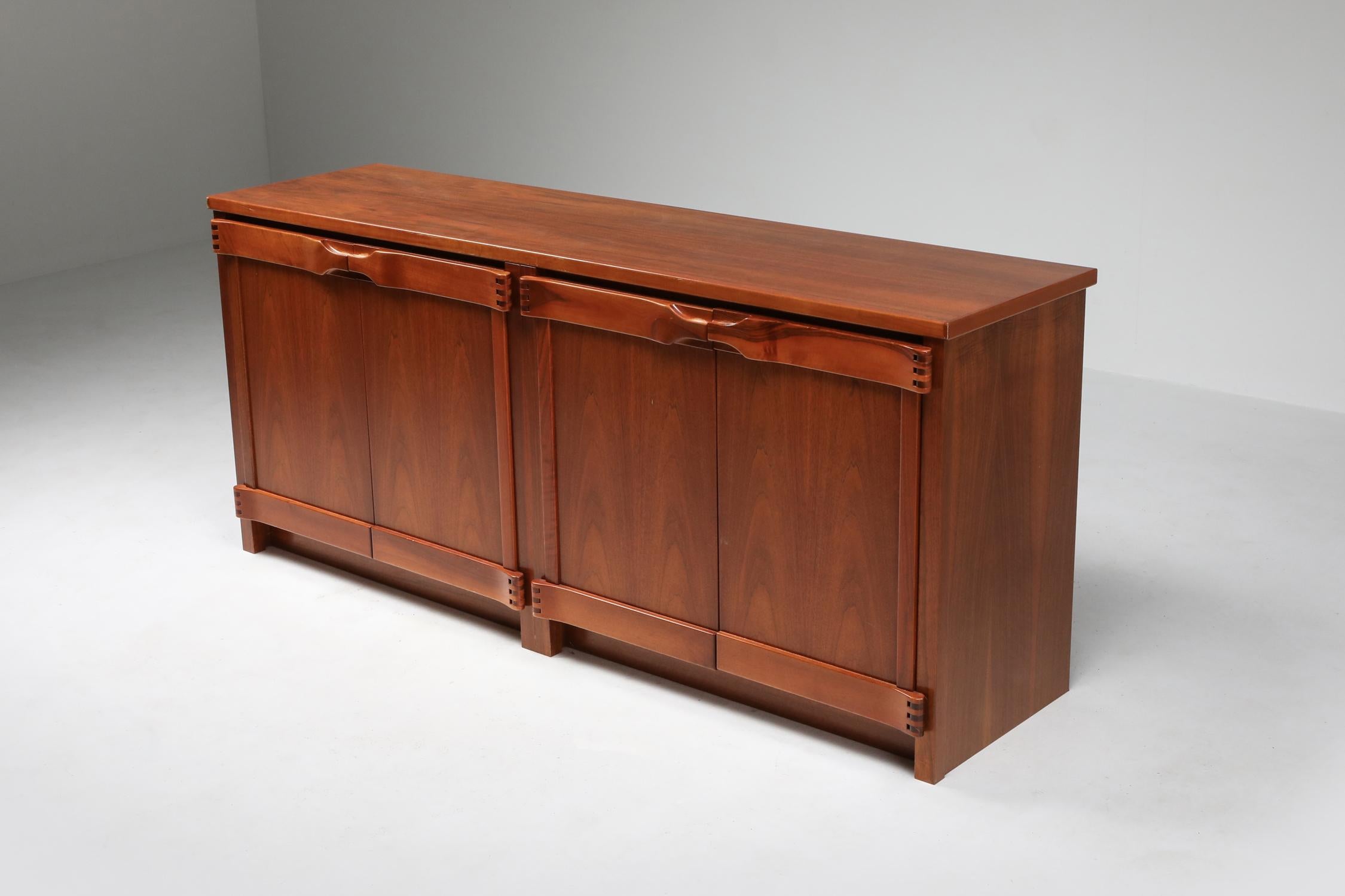 Chapo style sideboard in walnut by Franz Xaver Sproll, 1960s.
Fantastic use of hinges and connections just as Pierre Chapo did in the same era.
Gorgeous high end midcentury to Postmodern pieces.
  