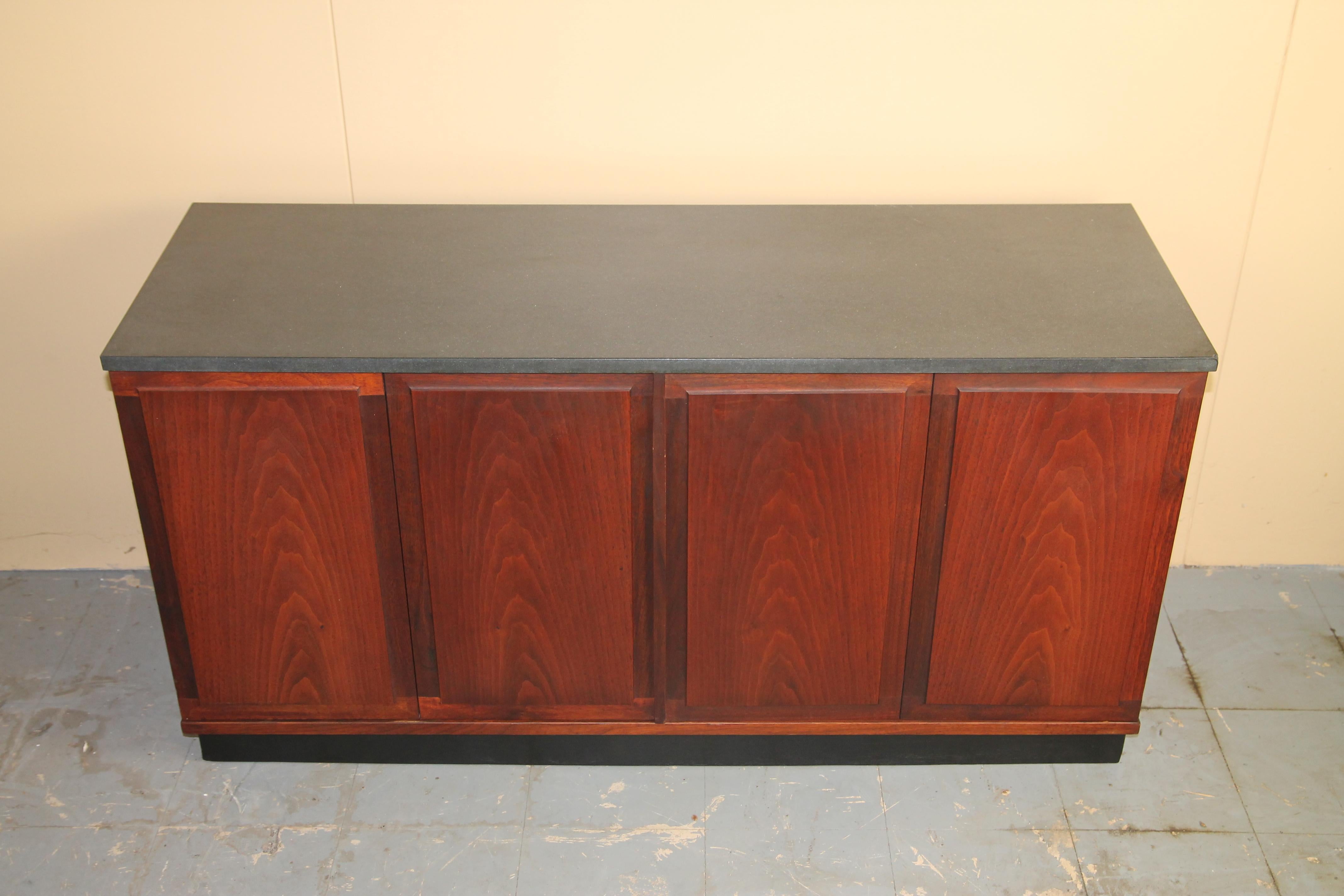 Nice small scale cabinet made of walnut with a slate top.