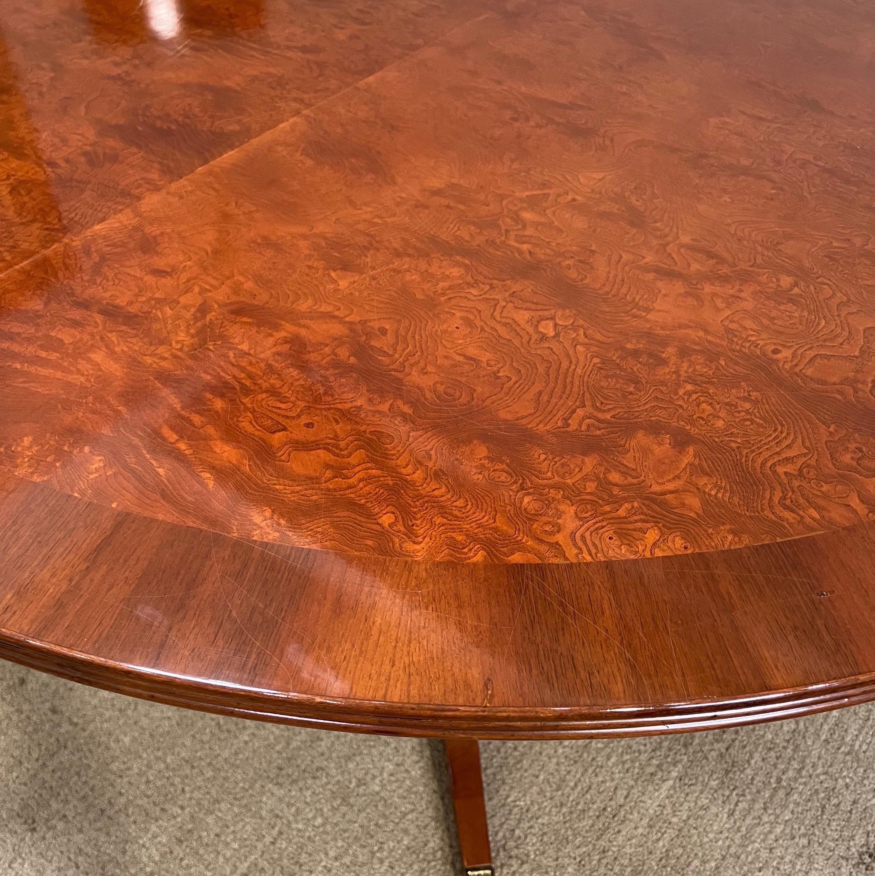 Walnut cross-banded extension dining table with 
1 leaf on a single quadruped base. It’s original finish in good condition with underlying craquelure effect to the finish.