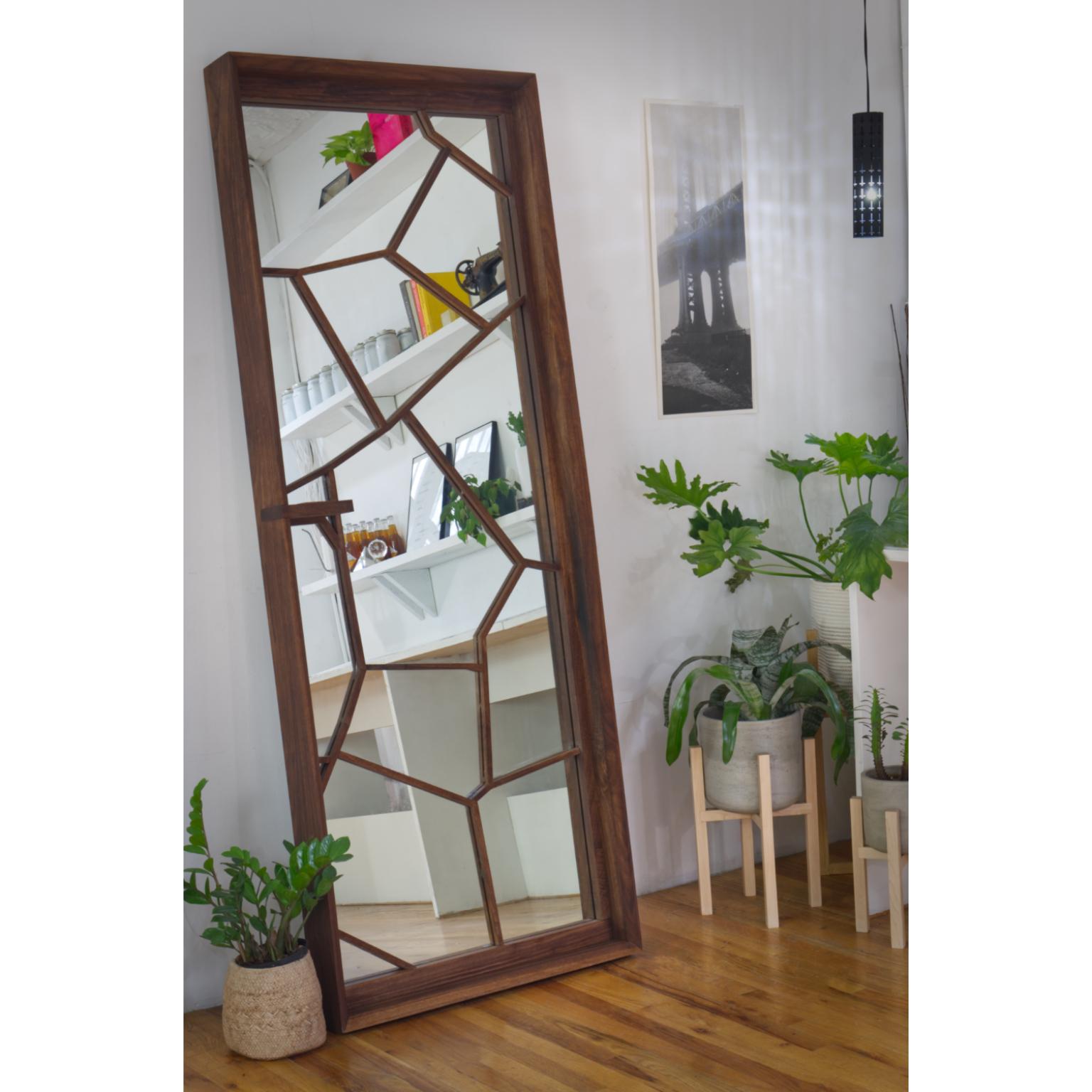 Constructed from solid American walnut the mirror is a portal to another universe. Standing at 6’+ tall it doubles space and stands at your favorite wall for the creation of the days outfit and beyond. We were interested in the fracture with this