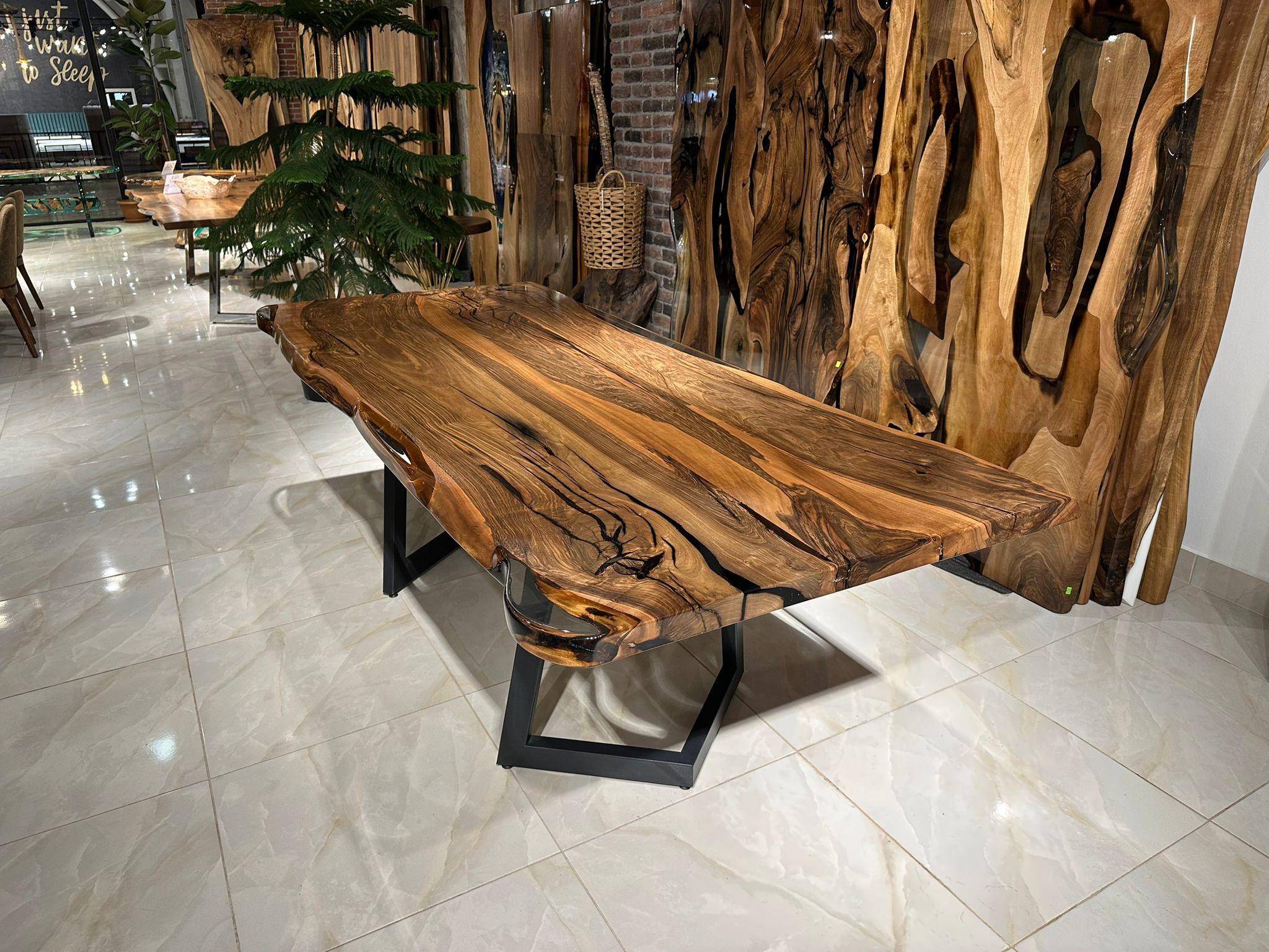 Custom Walnut Live Edge Epoxy Resin Conference Room Table 

This table is made of Walnut Wood. The grains and texture of the wood describe what a natural walnut woods looks like.
It can be used as a dining table or as a conference table. Suitable