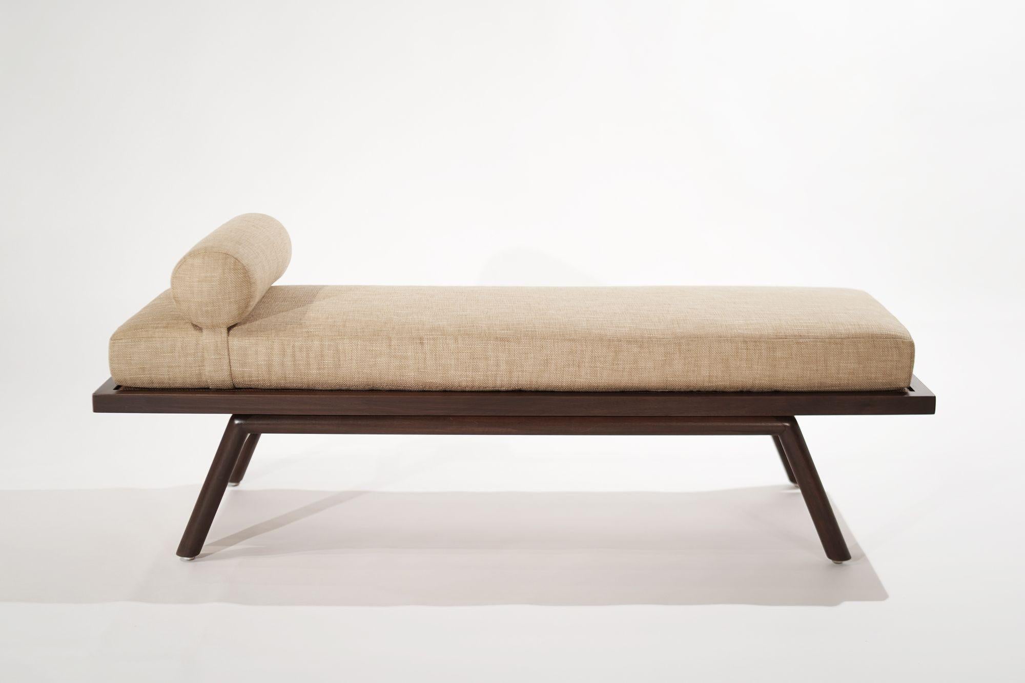 Mid-Century Modern daybed or coffee table designed by T.H. Robsjohn-Gibbings for Widdicomb, circa 1950-1959. This multifunctional beauty serves as a daybed/bench as well as a coffee table with a caned top, the cushion is upholstered in sand twill.
