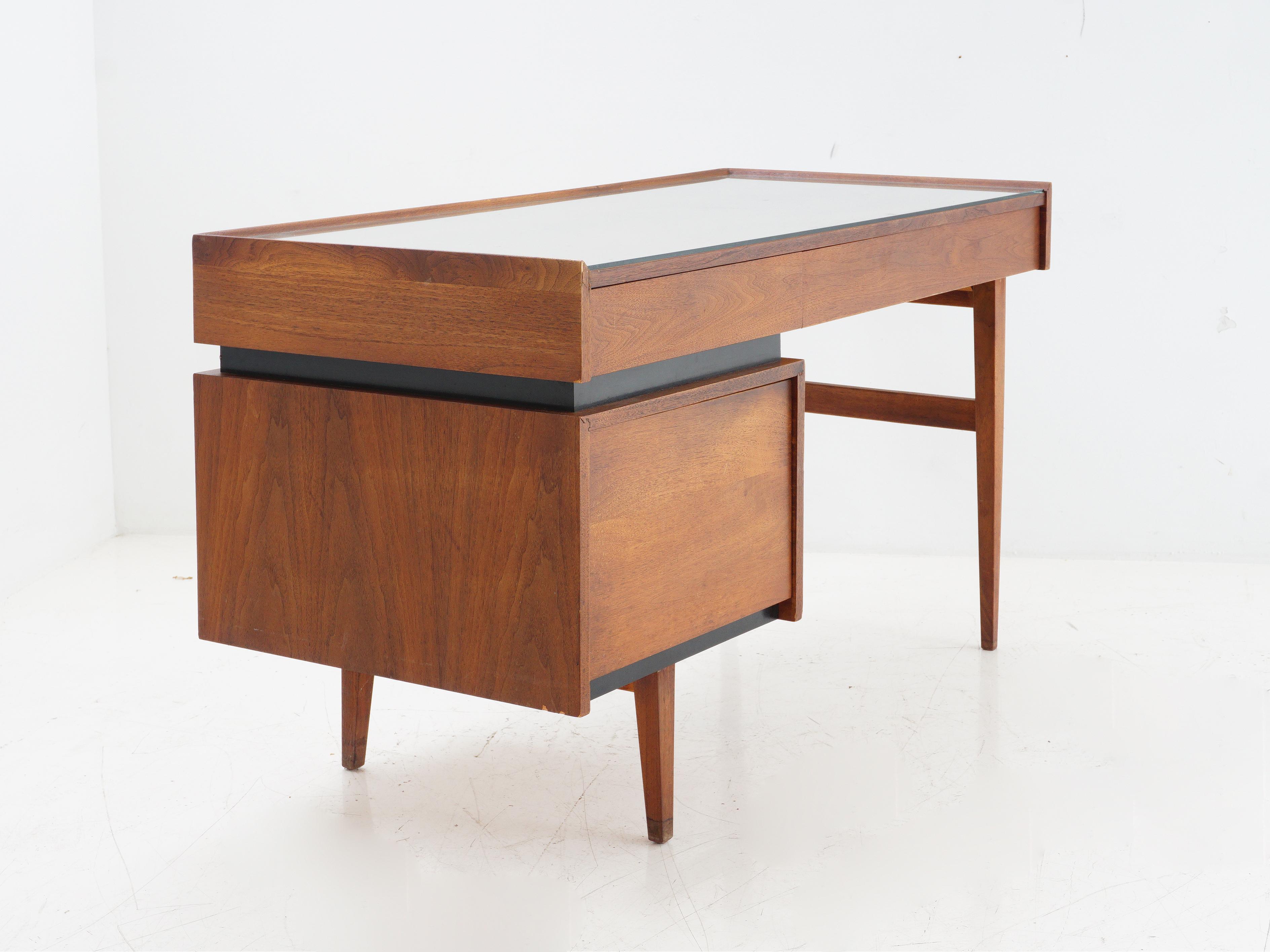 Let's get down to business with this walnut desk, designed by Merton Gershun for Dillingham Furniture - where mid-century modern meets early Monday meetings. Transform your office into a  den of productivity, because conquering deadlines should