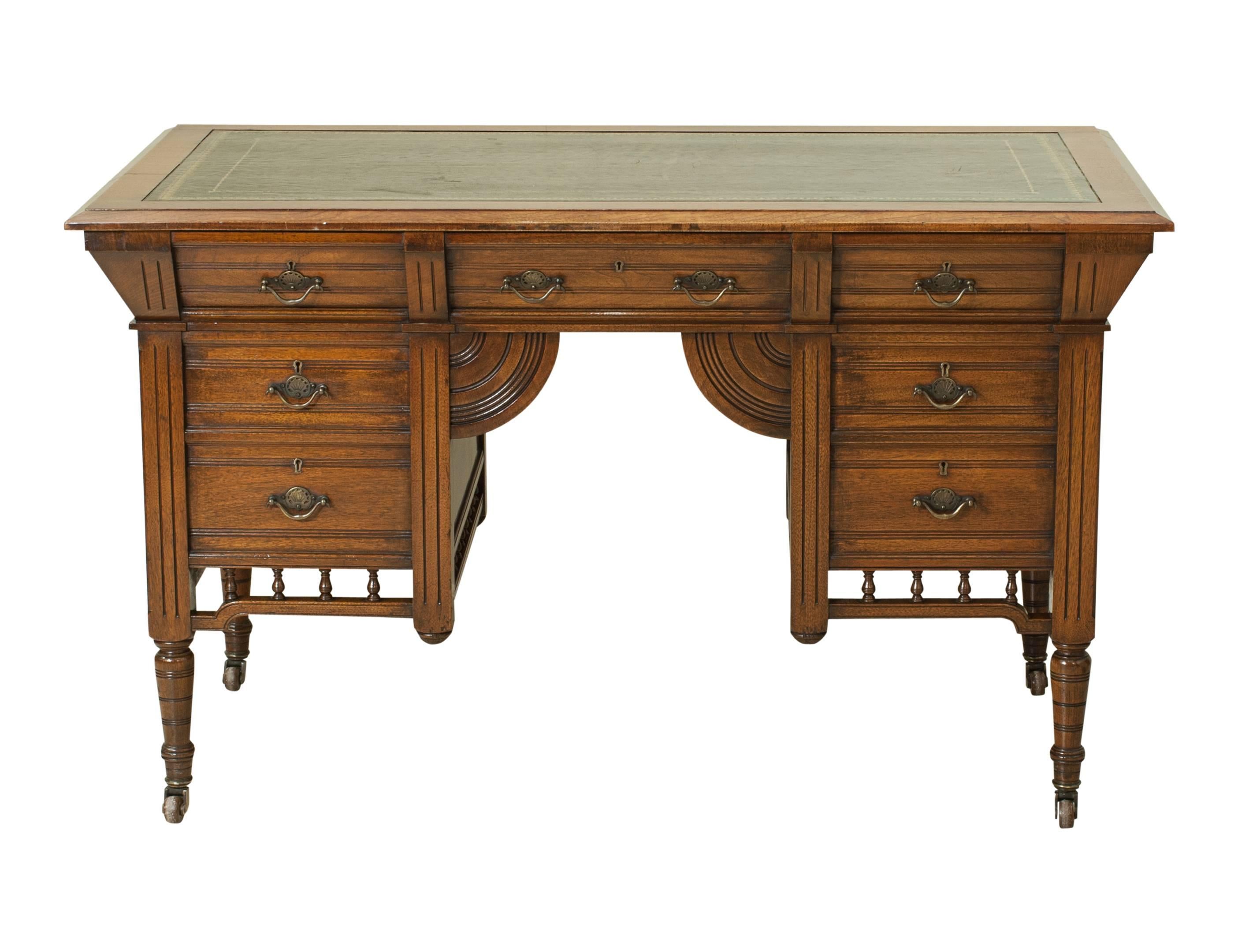 Small walnut partners desk.
A fine Victorian free standing walnut partners desk made in the Channel Islands by Lovell & COX. The desk with a green inset leather top with gilt tooling, one side with dummy drawers the other with a total of seven
