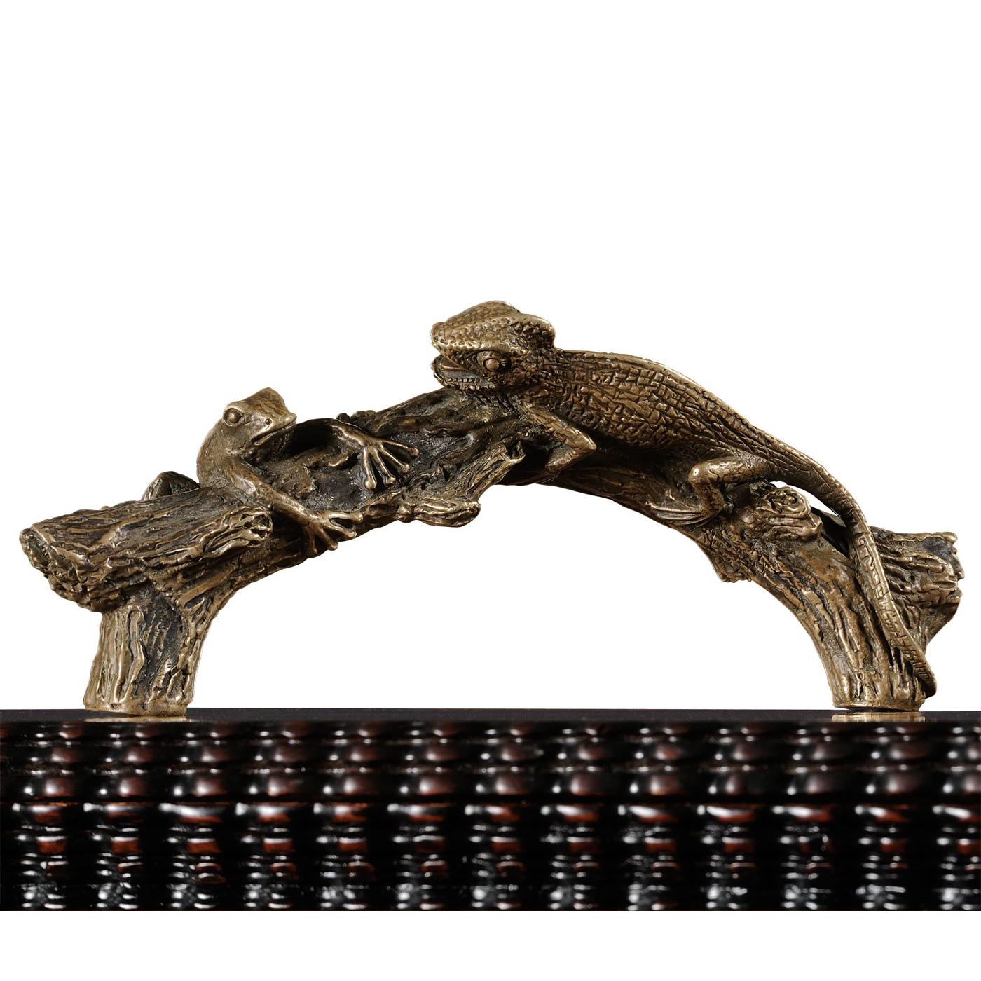 Decorative walnut and burl walnut veneered lidded box with heavily gadrooned mouldings and distressed finish. Finely cast brass handle naturalistically depicting a frog and chameleon on a branch.

Dimensions: 13.5