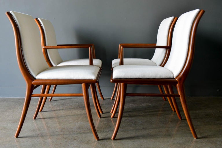 Walnut Dining Chairs by T.H. Robsjohn-Gibbings for Widdicomb, ca. 1960. Professionally restored walnut with gorgeous high end ivory tweed upholstery. Two chairs are with arms, two are without. Would consider selling as pairs as well

Chairs