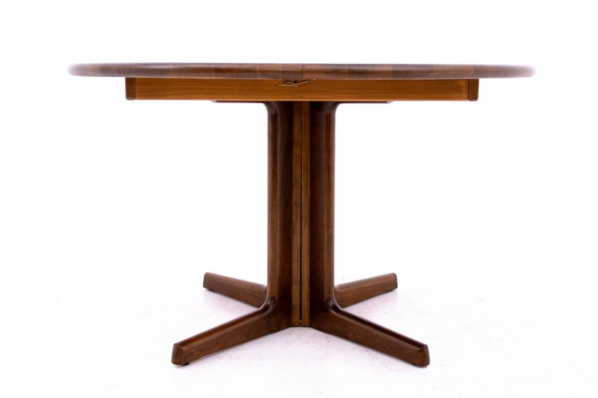 Wooden dining table manufactured in Denmark by Schou Andersen in the mid-20th century

The table extends with two additional inserts, each 50 cm wide

Height 72cm diameter 115cm (after adding one insert 165cm width, after adding two inserts