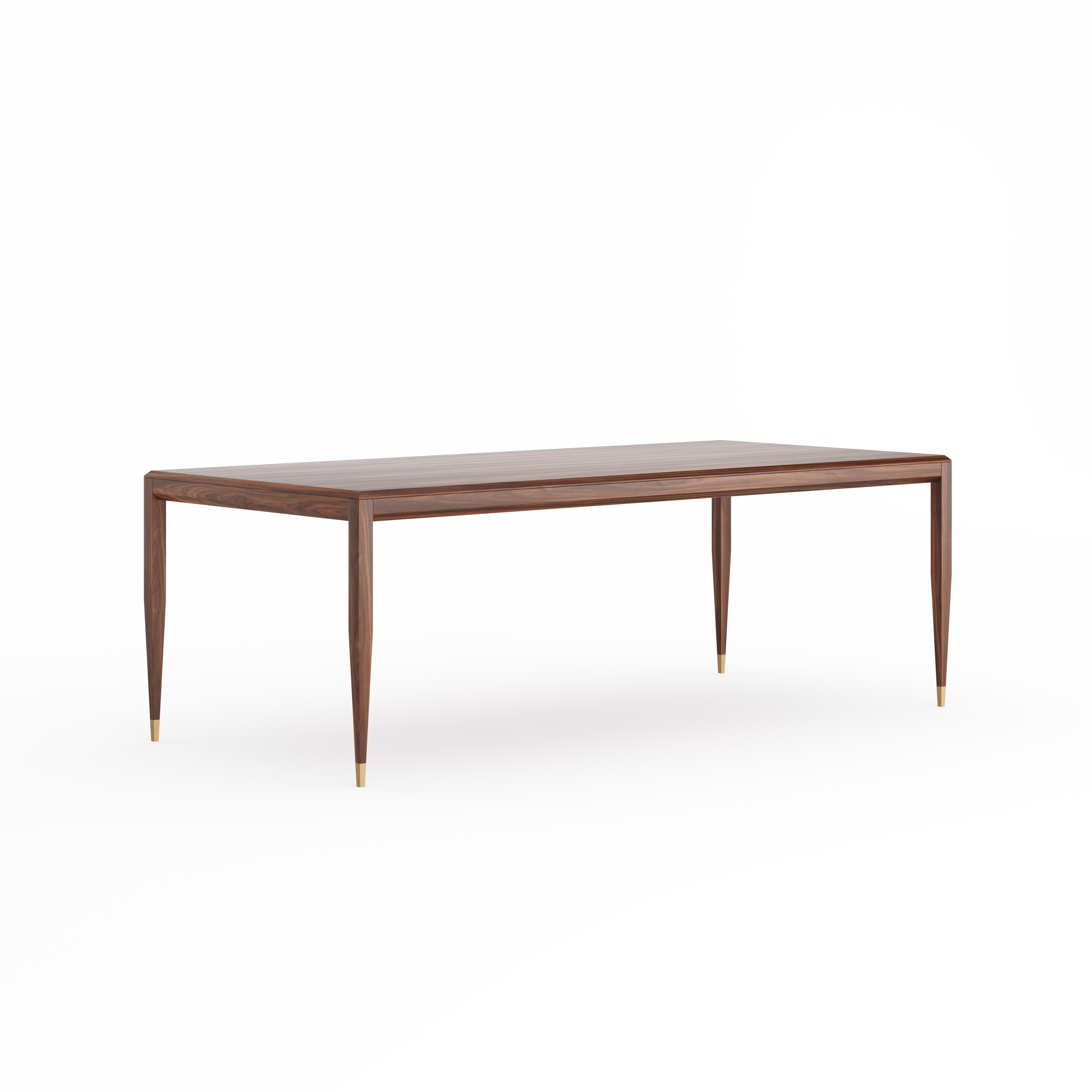 Mesa de comedor de nogal de estilo de mediados de siglo con patas cónicas con pies de latón. Mesa de madera maciza de nogal americano y madera revestida de chapa gruesa de nogal americano natural acabada con barniz de alta calidad.
Hecho a mano en