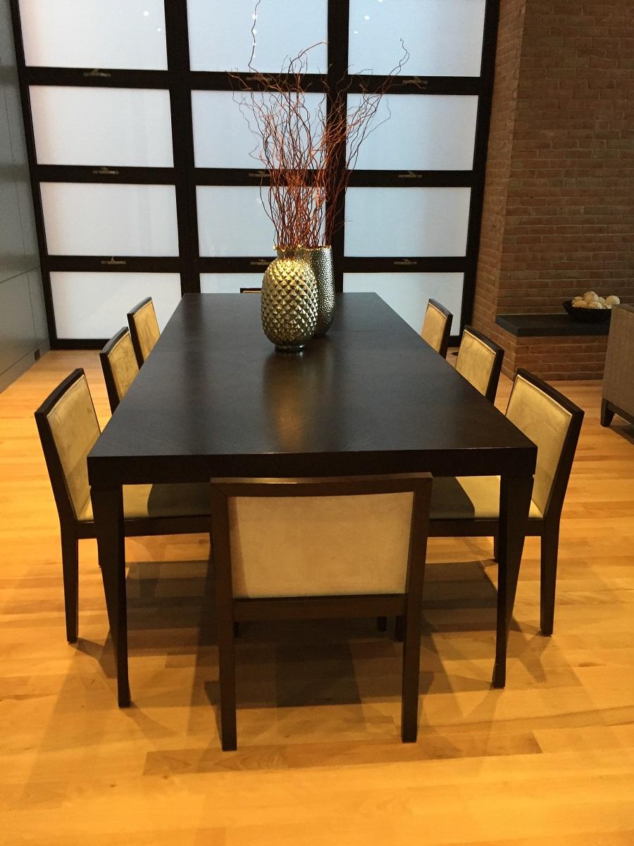 Walnut dining table with no obstruction for 14 diners
Rich walnut, sleek and elegant, this custom made dining table extends from 90