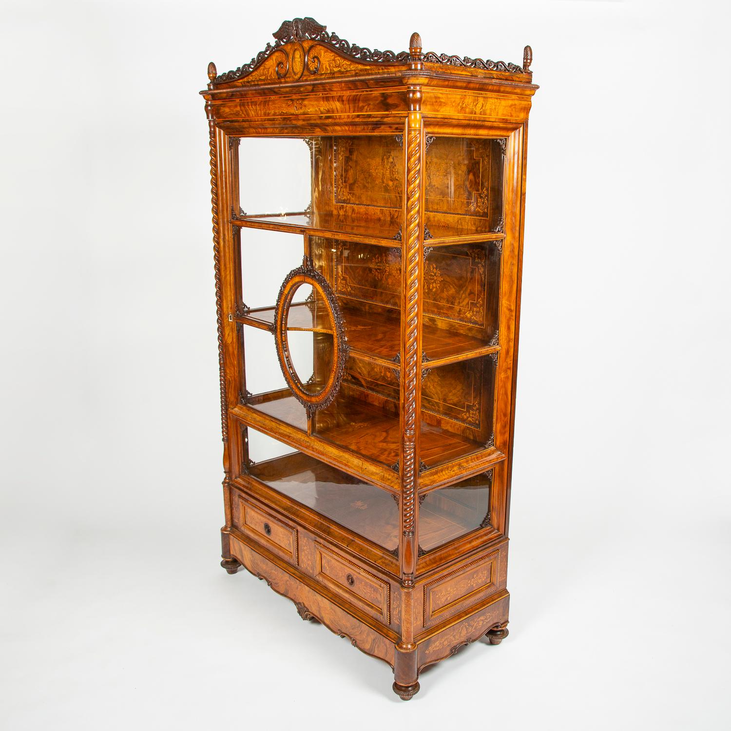 A very high quality mid-19th century carved and inlaid walnut display cabinet, with the monogram of Großherzog (Grand Duke) Friedrich I of Baden. 

The interior of the cabinet has 3 shelves, with the back is decorated with highly detailed inlay,