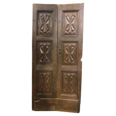 Walnut door, two leaves with diamond-point carved panels, from Milan Italy