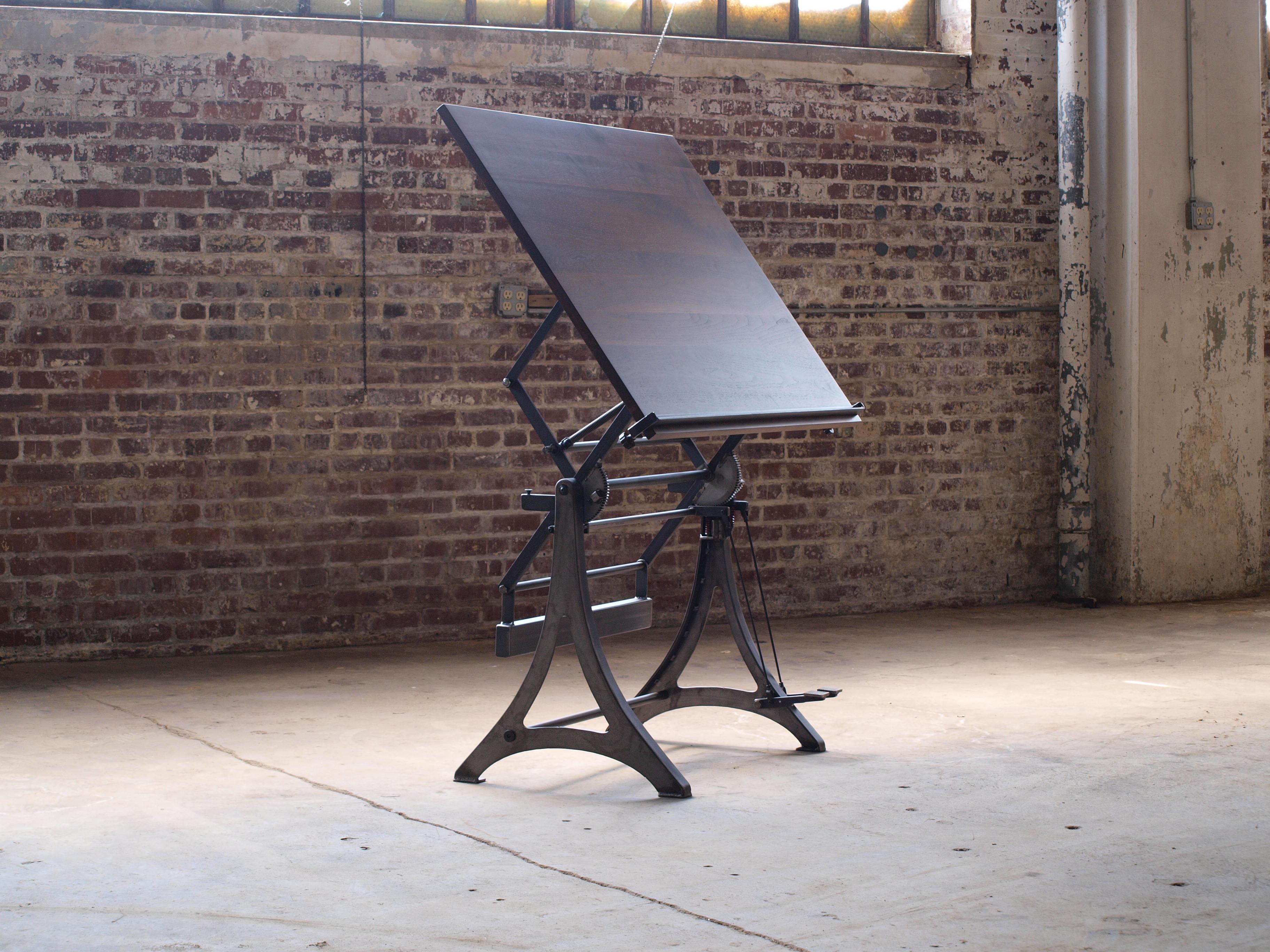 Handcrafted in Baltimore. This Marabu inspired, custom-crafted drafting table is a fully functional piece. It boasts an adjustable height and tilt feature that effortlessly adjusts via a counterbalanced system. The tabletop is crafted from solid