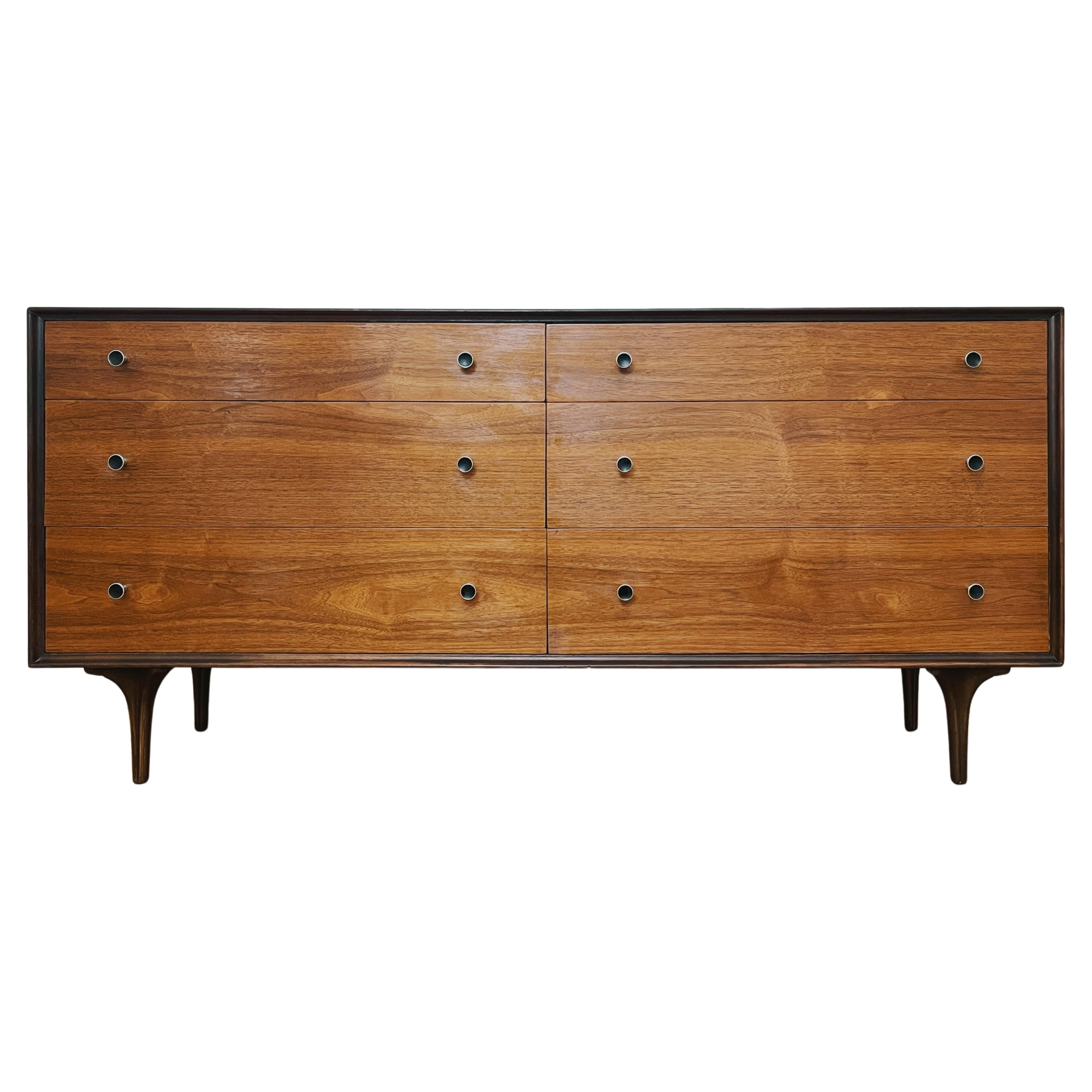 Walnut chest of drawers designed by Craig Nealy for Glenn of California, c. 1950s. Six drawers with black enameled chrome pulls; bottom drawers with built-in dividers. Classic modern silhouette, sleek and understated. Warm and rich walnut grain,