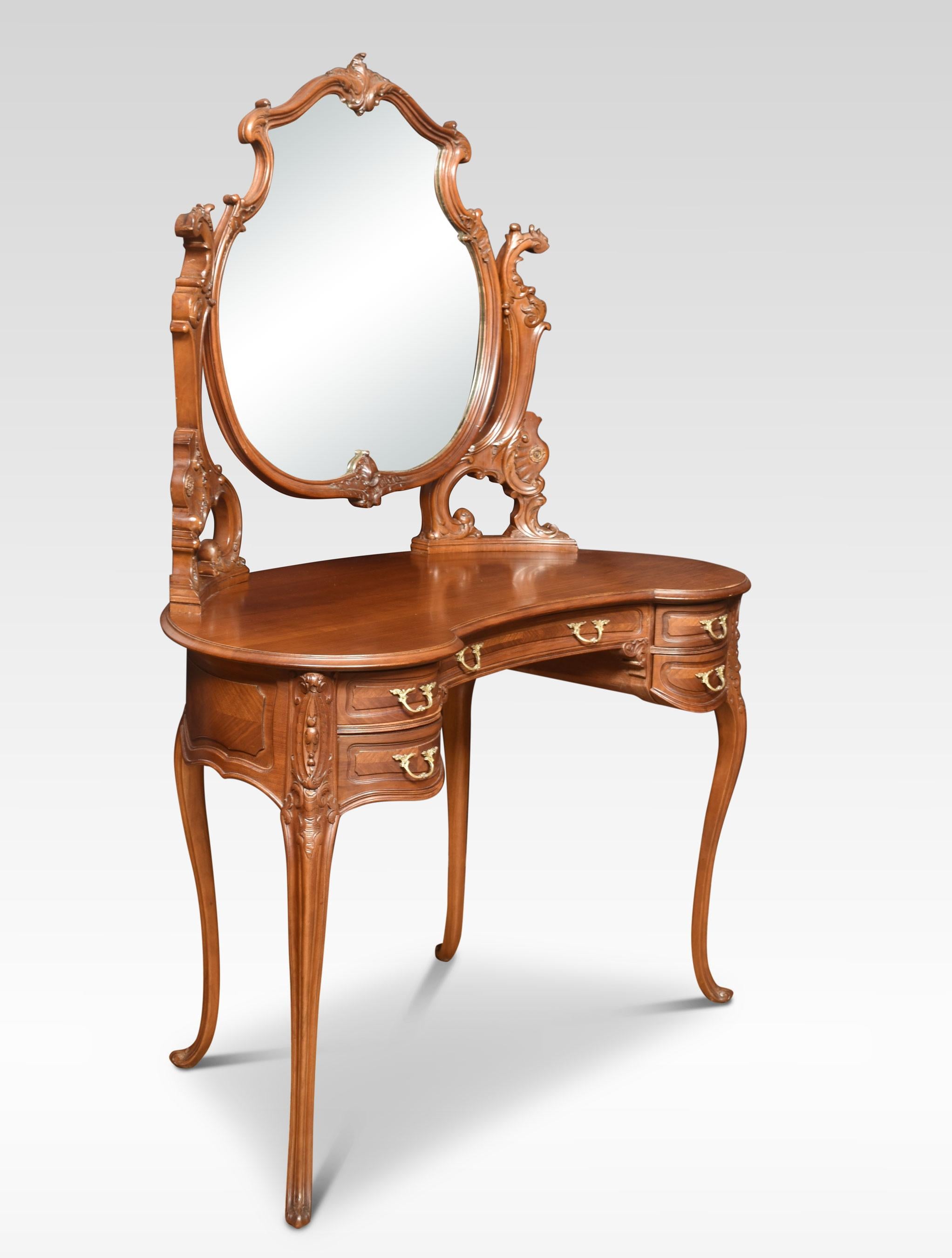 Walnut dressing table the original mirror plate in a carved frame between shaped supports. The walnut top above an arrangement of drawers with brass handles. All raised up on slender cabriolet supports.
Dimensions
Height 65.5 inches
Width 45