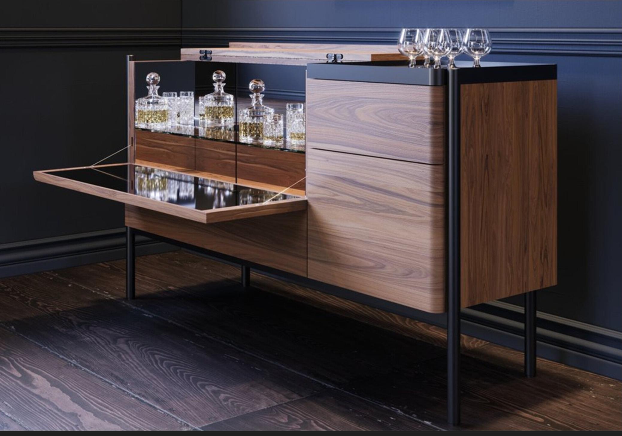 This extremely elegant solid high quality Walnut wood Dry Bar Sideboard is the combination of a traditional sideboard with a sophisticated drinks cabinet.
The design was inspired by ancient jewellery boxes: simple, neat containers of precious and