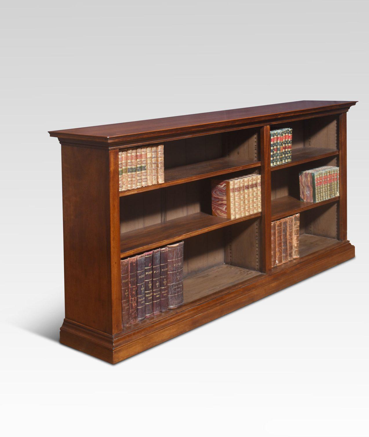  Walnut open bookcase, the large rectangular well-figured top. Above two bays of adjustable shelves divided by column. All are raised on a plinth base.
Dimensions
Height 36.5 Inches
Width 71.5 Inches
Depth 15 Inches