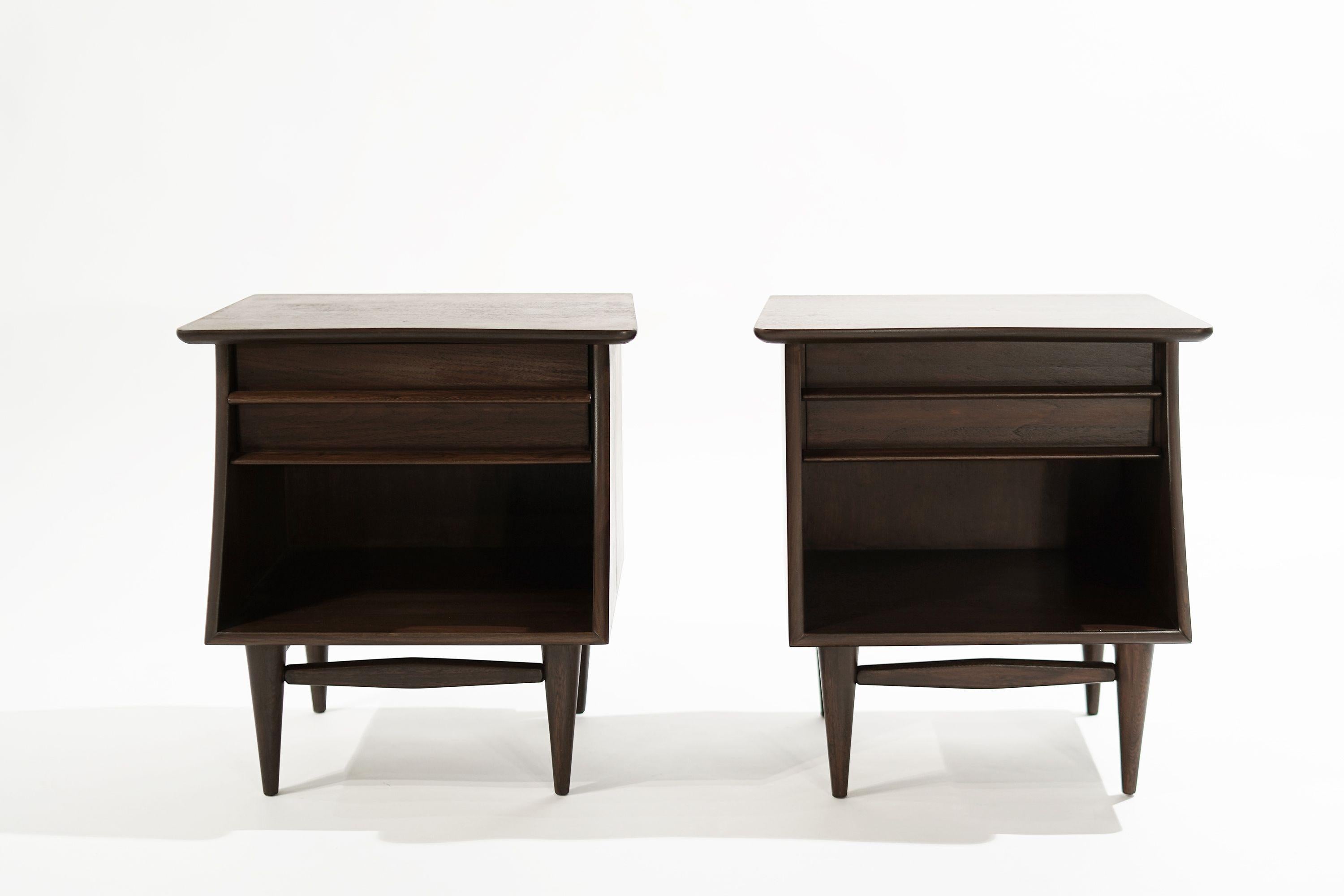 Set of end tables by Kent Coffey, circa 1950s. Executed in walnut, featuring sculptural forms and drawer and shelving for storage. Completely restored. Other designers from this period include Paul McCobb, Vladimir Kagan, Hans Wegner, Gio Ponti, and