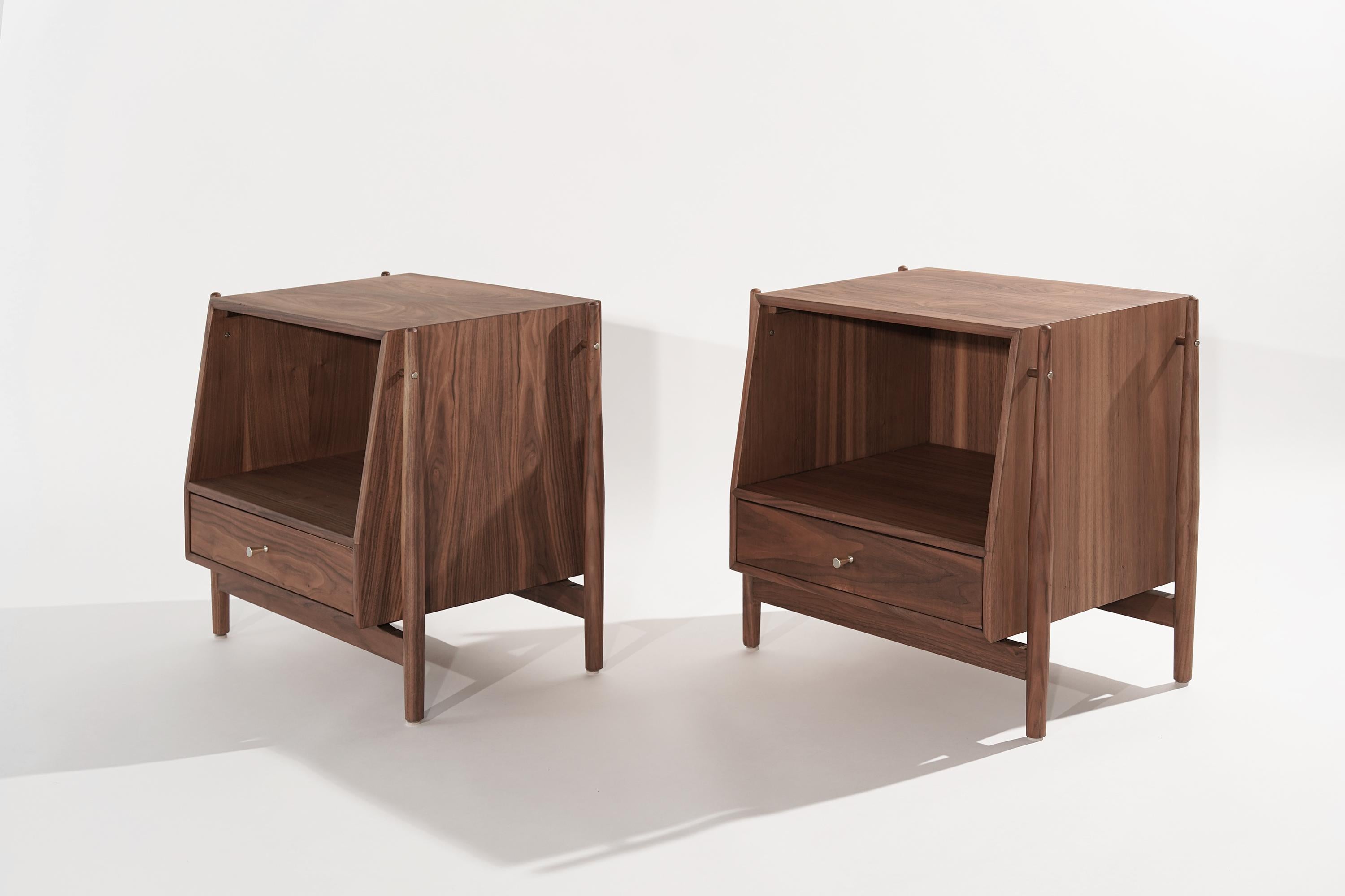 A fully restored pair of end tables or bedside tables designed by Kipp Stewart, circa 1950s. Exposed walnut framework, featuring our organic matte finish.

Other designers of the period include Vladimir Kagan, Paul McCobb, Hans Wegner, Gio Ponti,