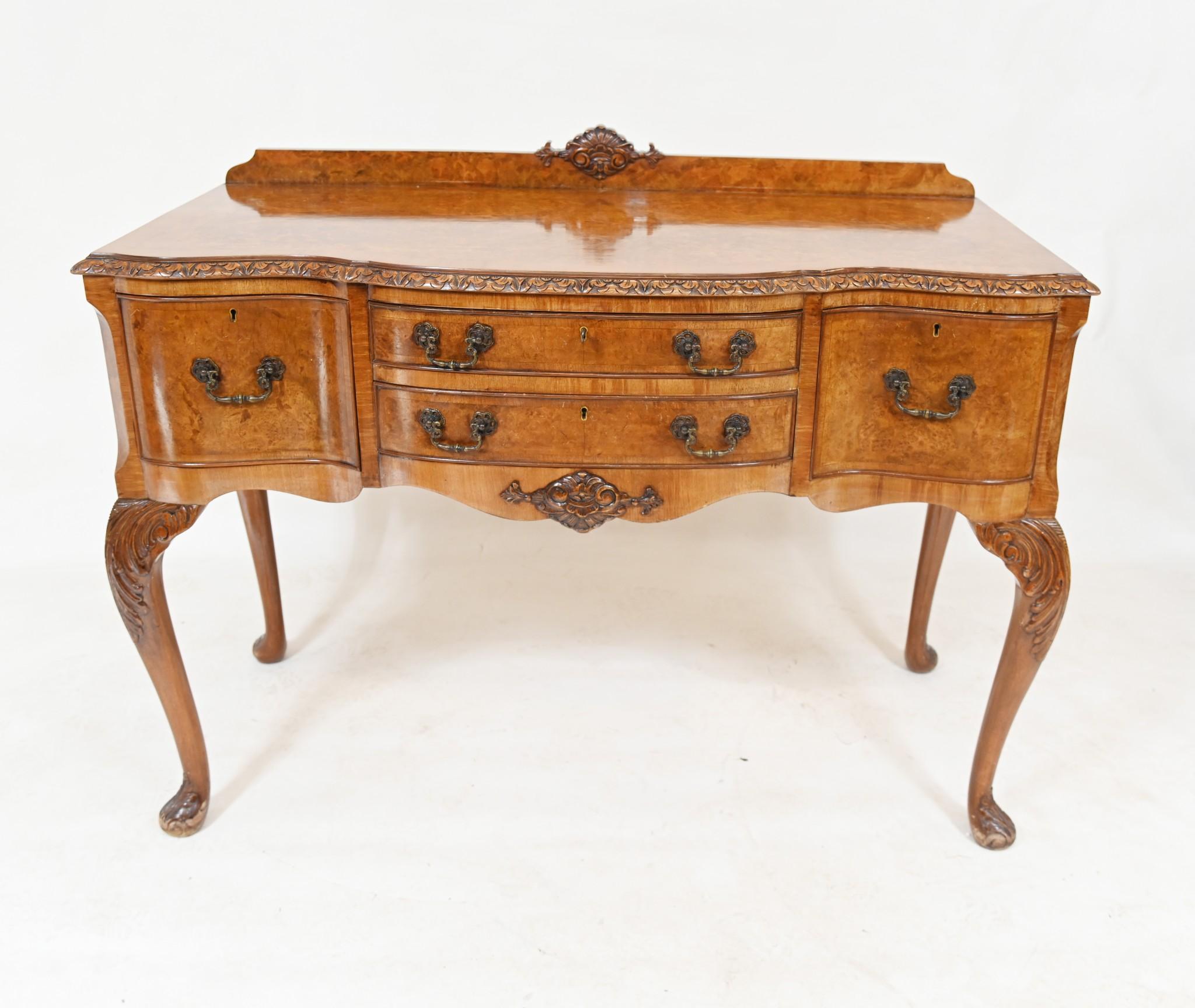 You are viewing a gorgeous Epstein walnut sideboard
We date this piece to circa 1930
Great look with the elegant shaped to the walnut front
Original fixtures - handles in metal
Elegant cabriole legs and hand carved details 
Love the light patina to