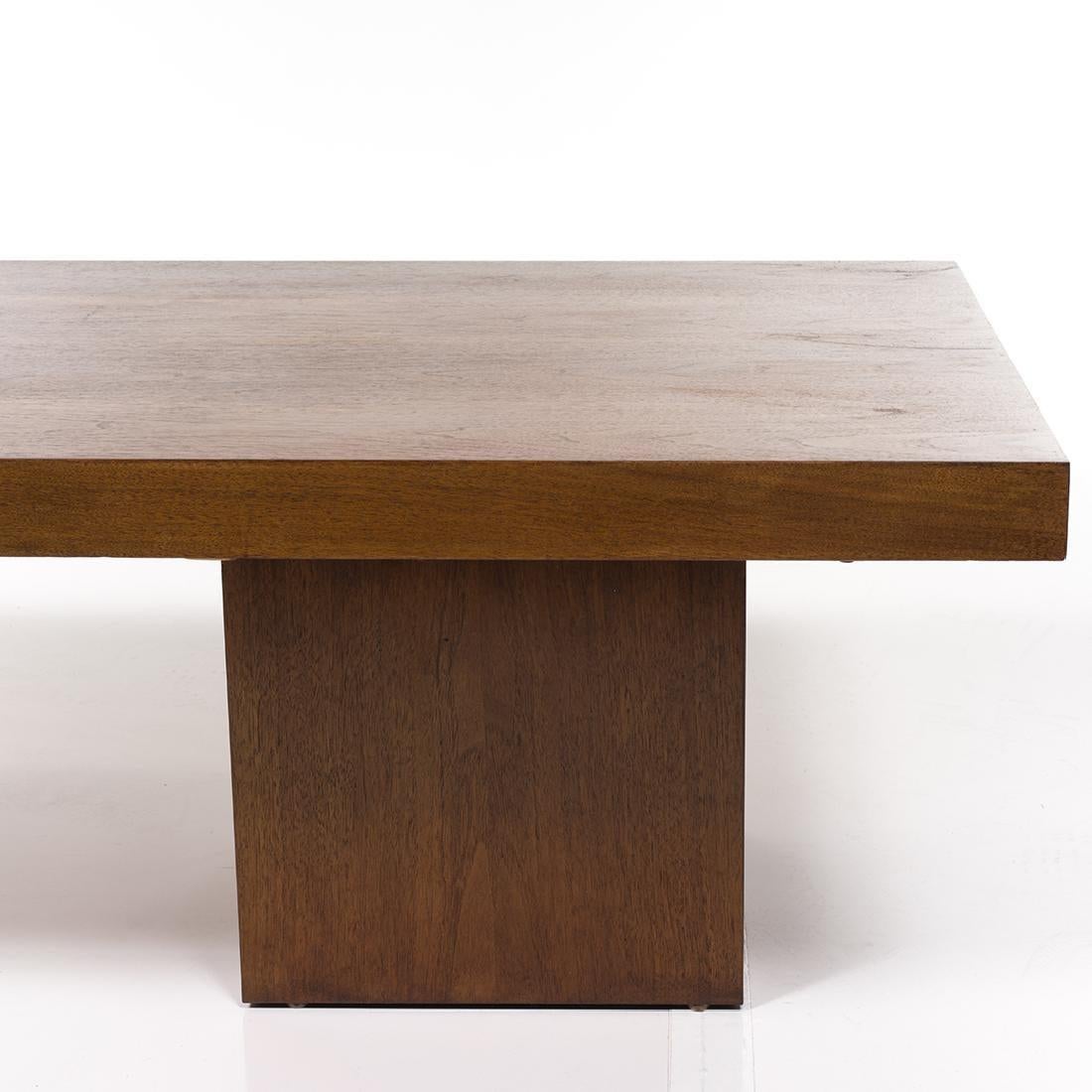 Mid-Century Modern expanding coffee table designed by John Keal for Brown Saltman in the United States, circa 1960s. This walnut wood coffee table extends up to 96” revealing a dark grey laminate surface in the center. The expandable top sits upon