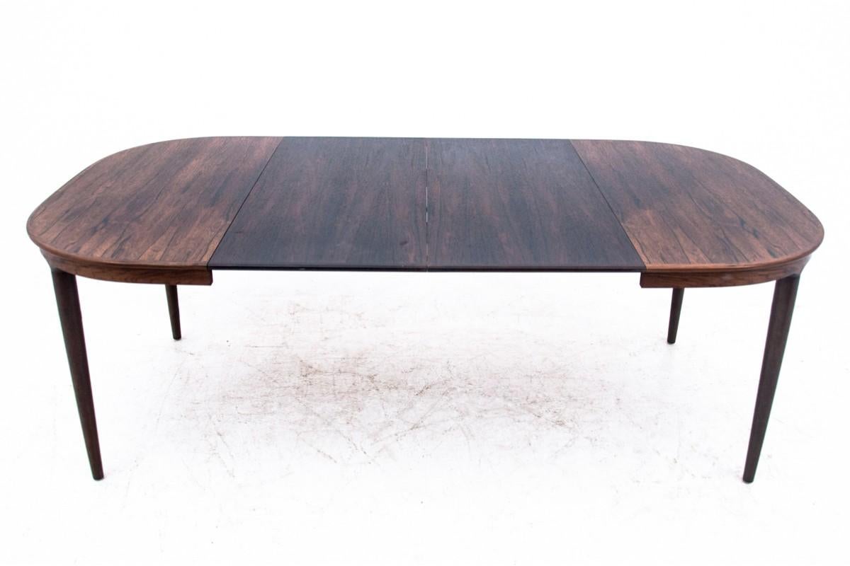Danish dining table from the 1960s.
Made of walnut wood. 
Table extends with two additional inserts up to 215cm
Dimensions: height 75 cm / length 115 cm - 215 cm / depth 115 cm.