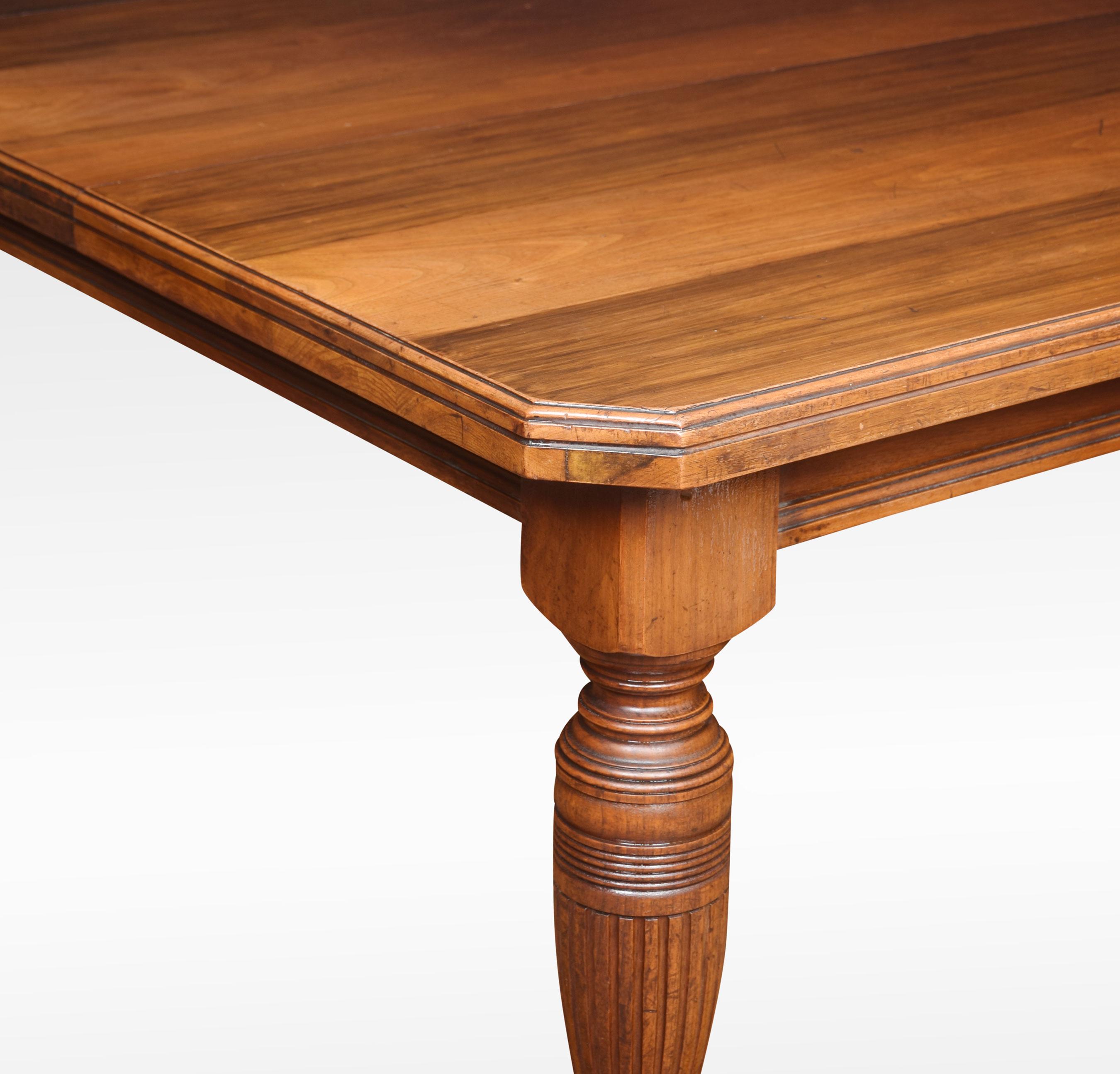 19th century walnut dining table, the rectangular top with canted corners and moulded edge. The telescopic action opening to incorporate large leaf. Raised up on turned tapering legs with ceramic casters.
Dimensions:
Height 29 inches
Width 48
