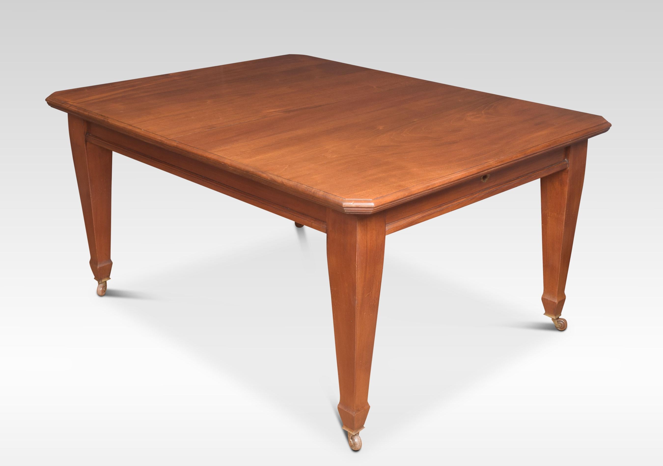 Walnut dining table, the rectangular top with canted corners and a moulded edge. To the telescopic action opening to incorporate three leaves, all raised up on tapering legs terminating in brass casters (will seat 10-12 people)
Dimensions
Height
