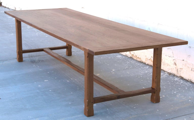 This custom table made from walnut has chamfered legs and fluted stretchers. It is seen here in 120