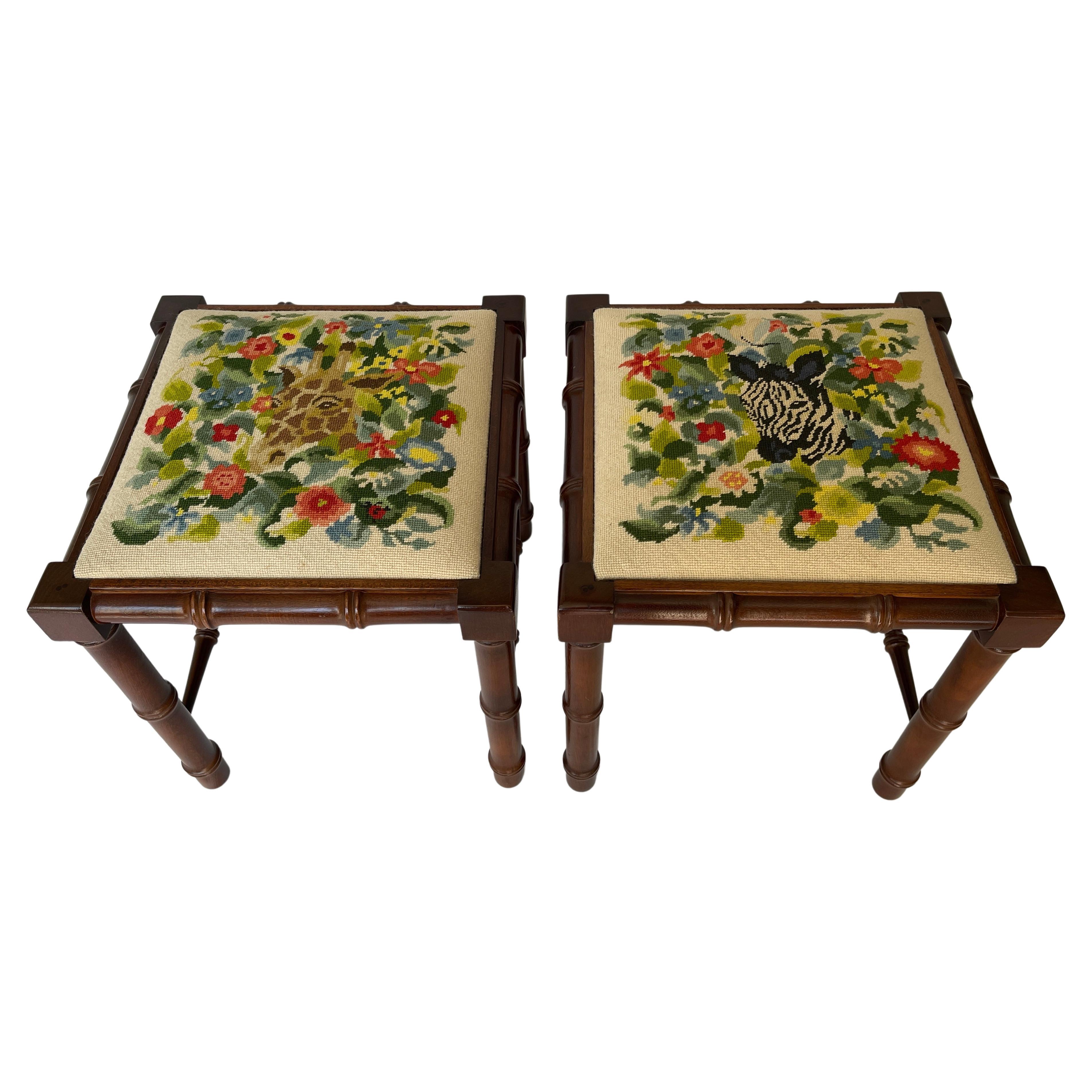 Pair of walnut faux bamboo ottoman / stools upholstered with hand stitched needlepoint Zebra surrounded by flowers on one, and a Giraffe on the other.
c. 1970's, North Carolina, USA.