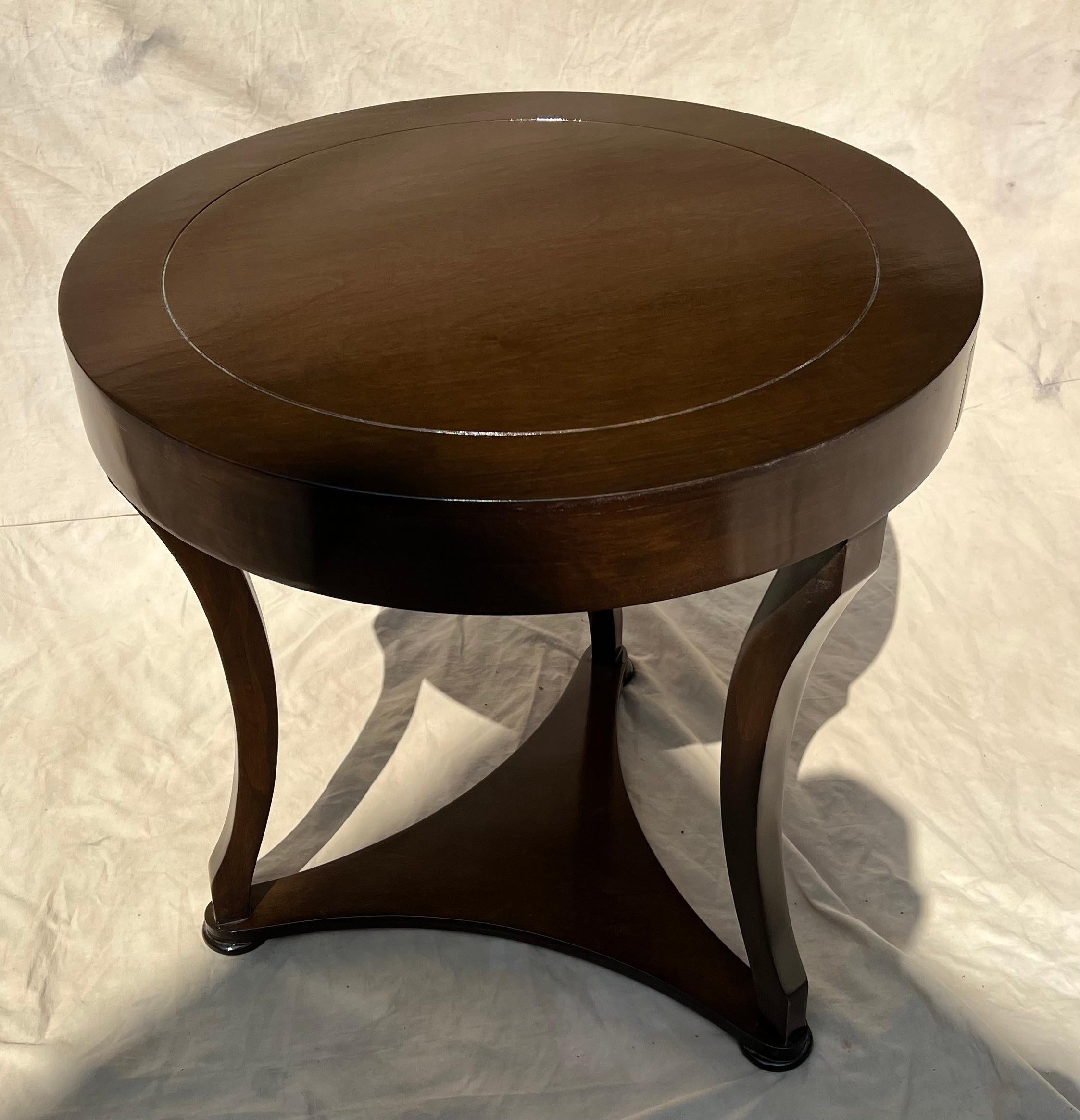 A walnut finish side table with drawer. The table is a wonderful side or bedside table. The finish is new and has no imperfections. We like the table without the drawer showing (turning the drawer to the back), however, if you need to store remotes