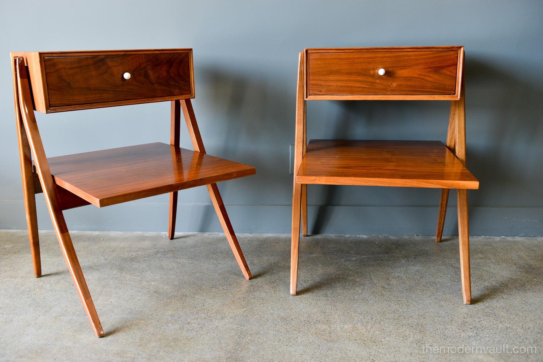 Walnut floating a frame nightstands or side tables by Kipp Stewart for Drexel, 1958. Beautiful original condition with hardly any wear. Original porcelain hardware and pullout / pull-out drawer with floating lower shelf and solid sculpted walnut