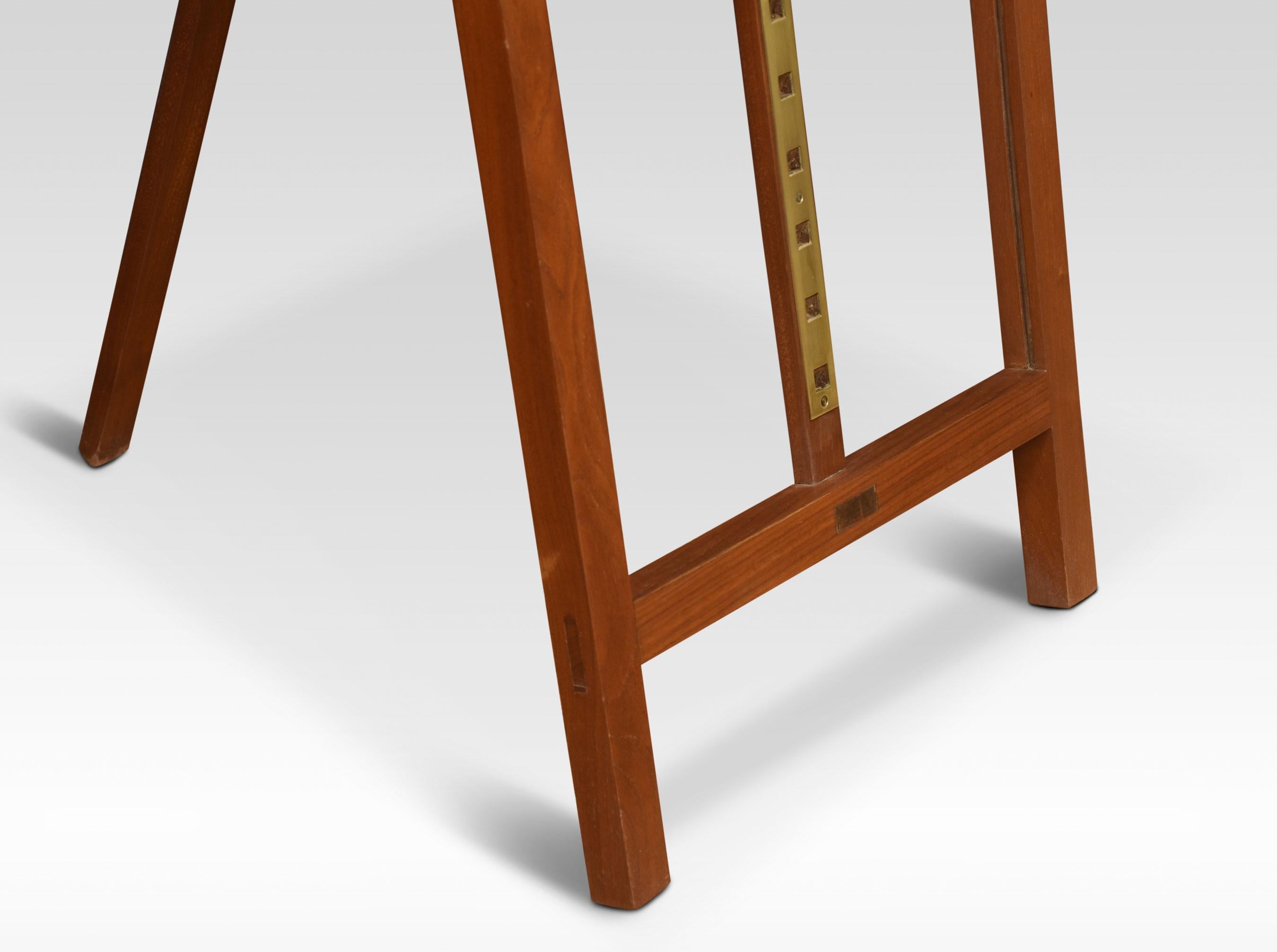 Walnut folding artists easel, the folding frame with a rise and fall shelf with hinged fall front.
Dimensions
Height 75 Inches Ajustable
Width 24 Inches
Depth 31 Inches.