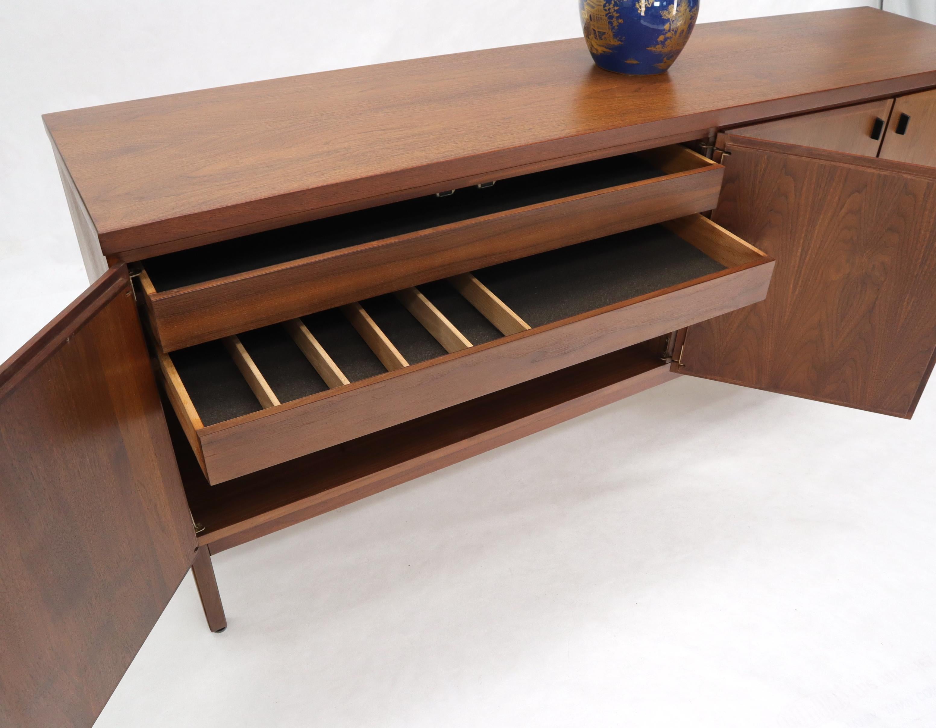 Mid-Century Modern long four doors compartment walnut credenza cabinet.