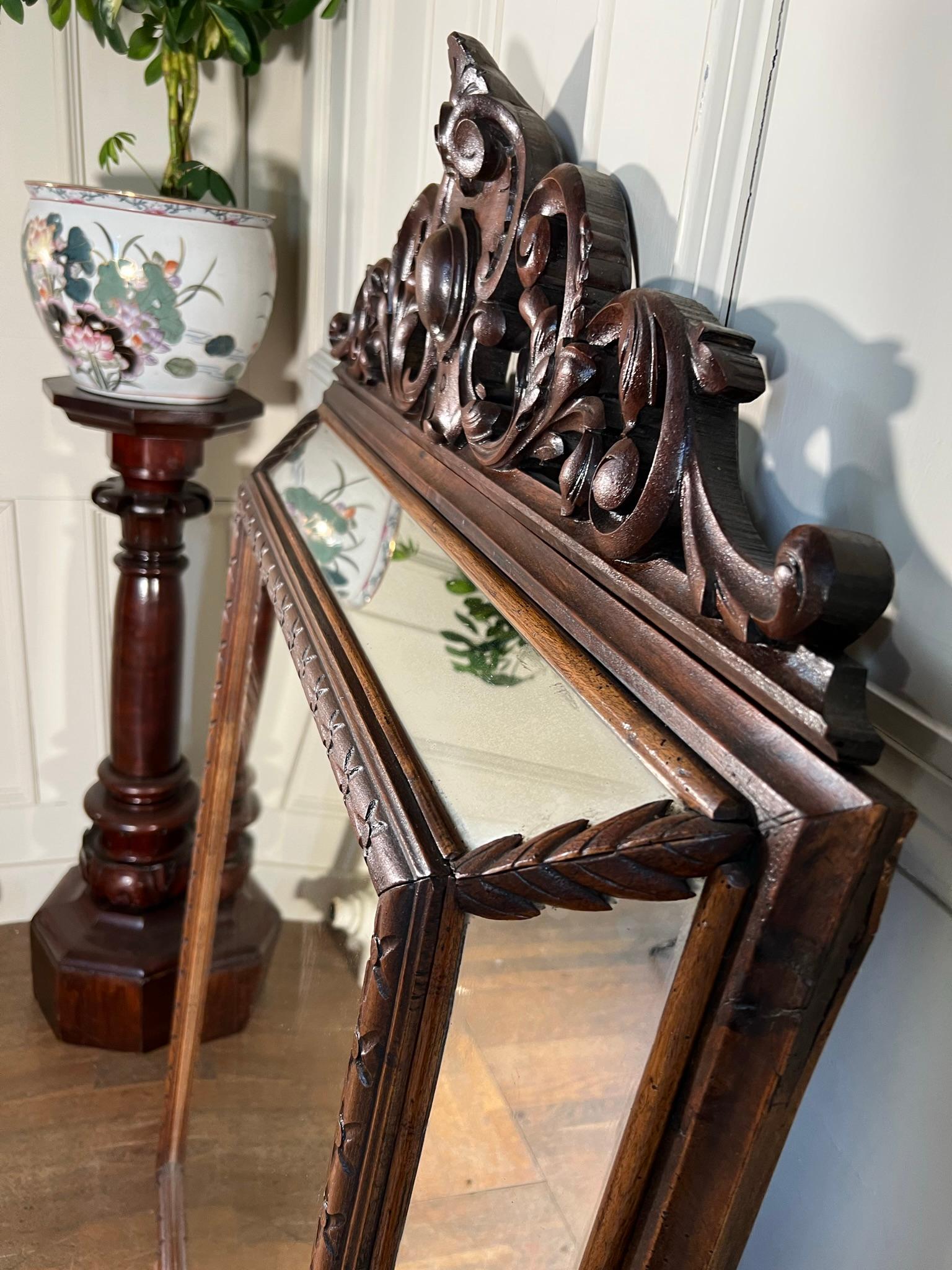 Highly decorated and carved walnut framed cushion mirror.

French early 20th century.

Measurements -146cm h x 90cm w x 15cm d
(measurements are approximate and are taken at the maximum points)

Ref - 6774