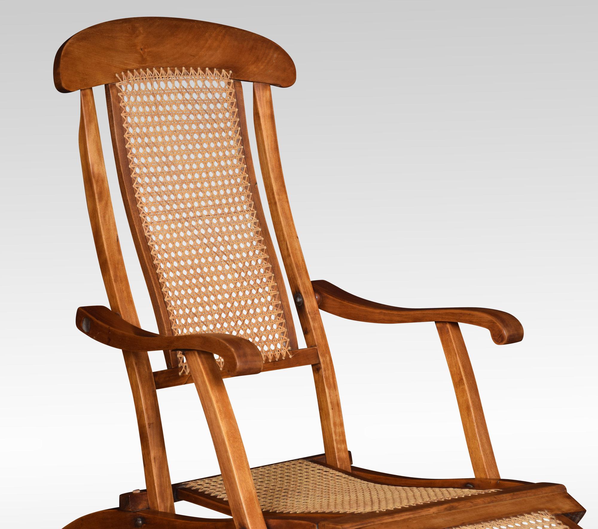 Walnut framed folding steamer deck chair. The cane work back and seat, flanked by scrolling arms and splayed legs. It folds very easily for storage.
Dimensions:
Height 38.5 inches
Width 50 inches
Depth 23 inches.