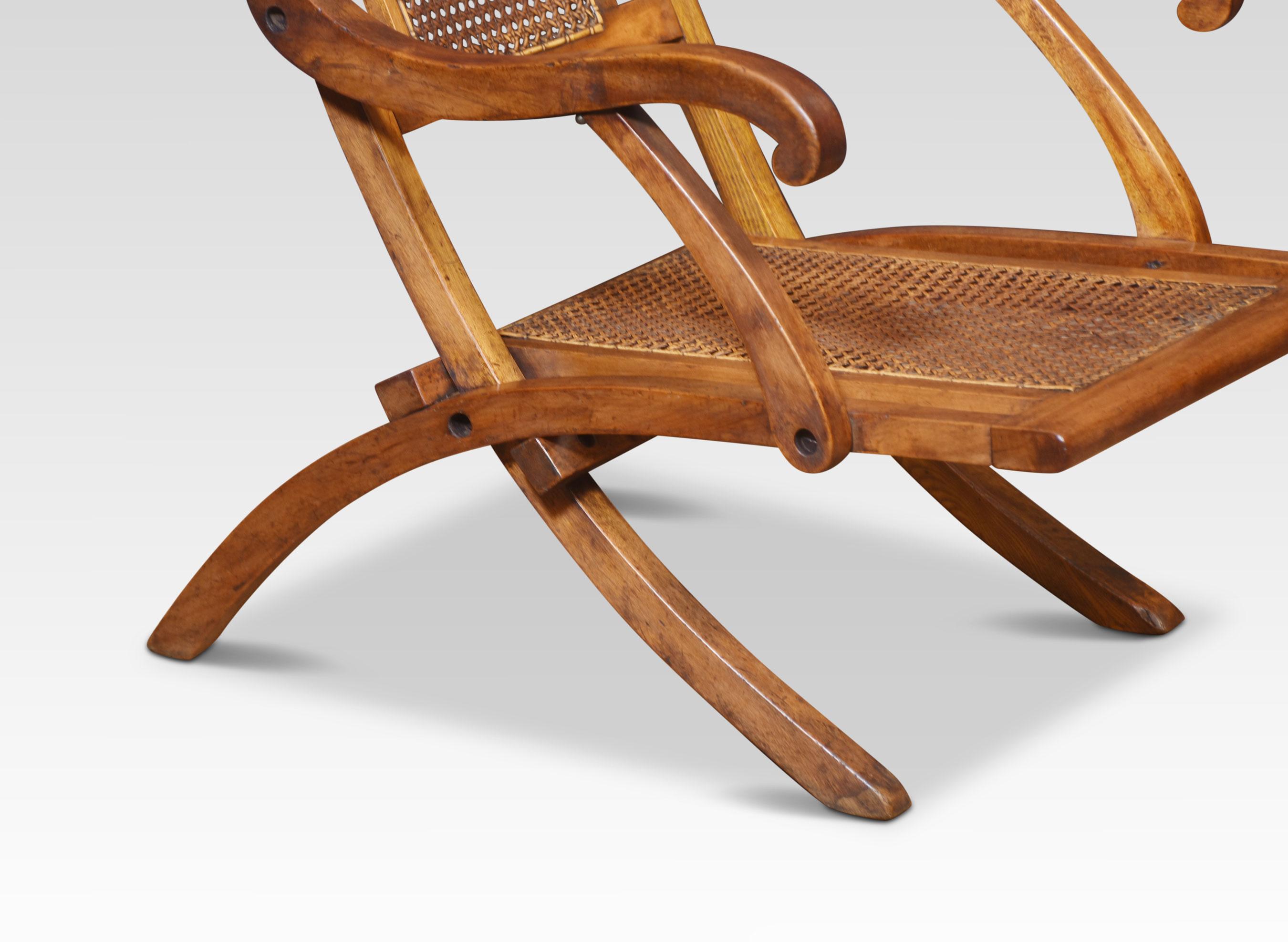 Walnut framed folding Steamer deck chair. The cane work back and low seats, flanked by scrolling arms and splayed legs. The desk chair folds away for very easily for storage.
Dimensions
Height 34 Inches height to seat 11.5 Inches
Width 20.5