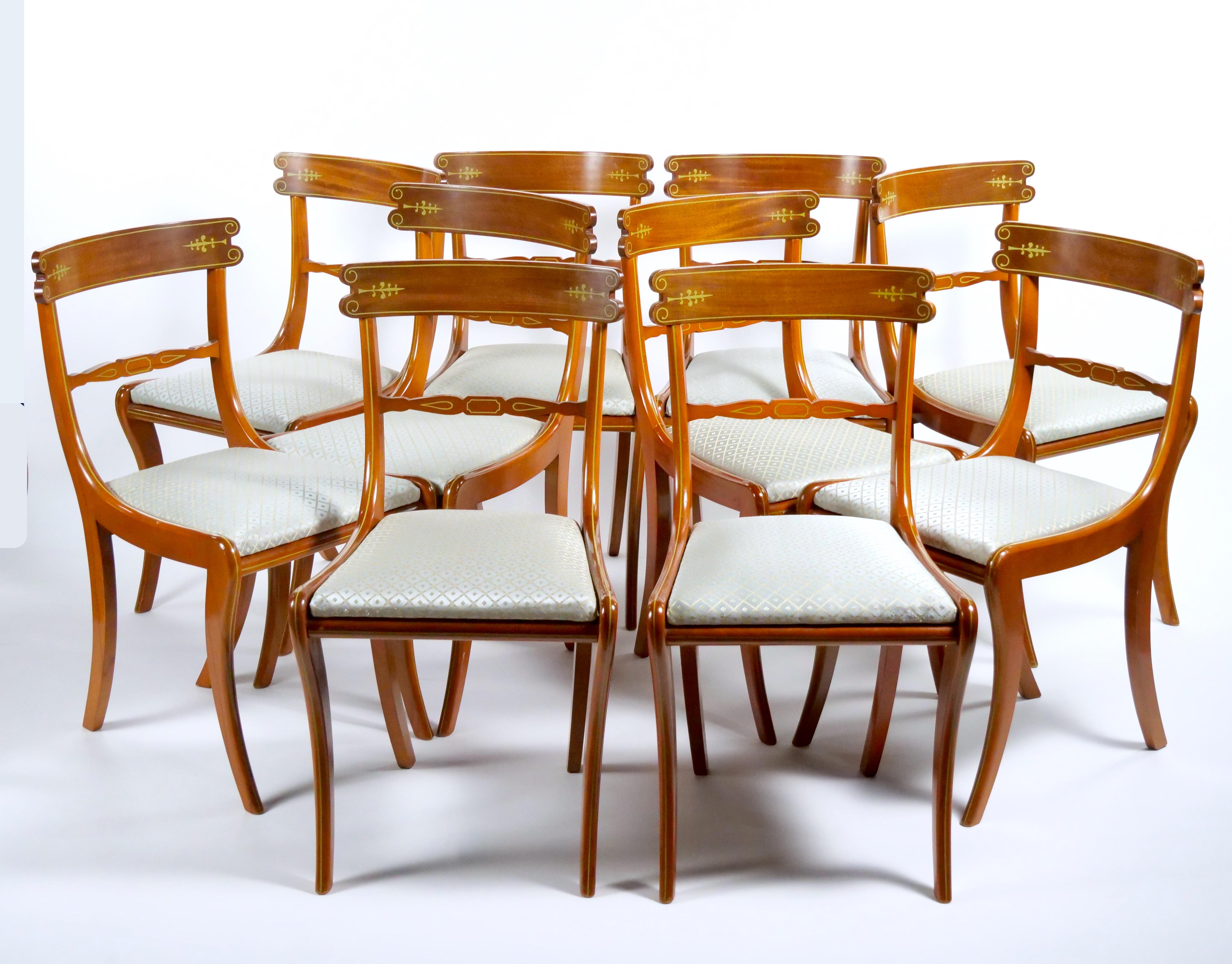 Enhance your dining experience with this Early 20th Century Italian Mahogany Framed Dining Room Chair Set, a beautifully crafted ensemble that accommodates ten people and adds a touch of sophistication to your dining space. The combination of the